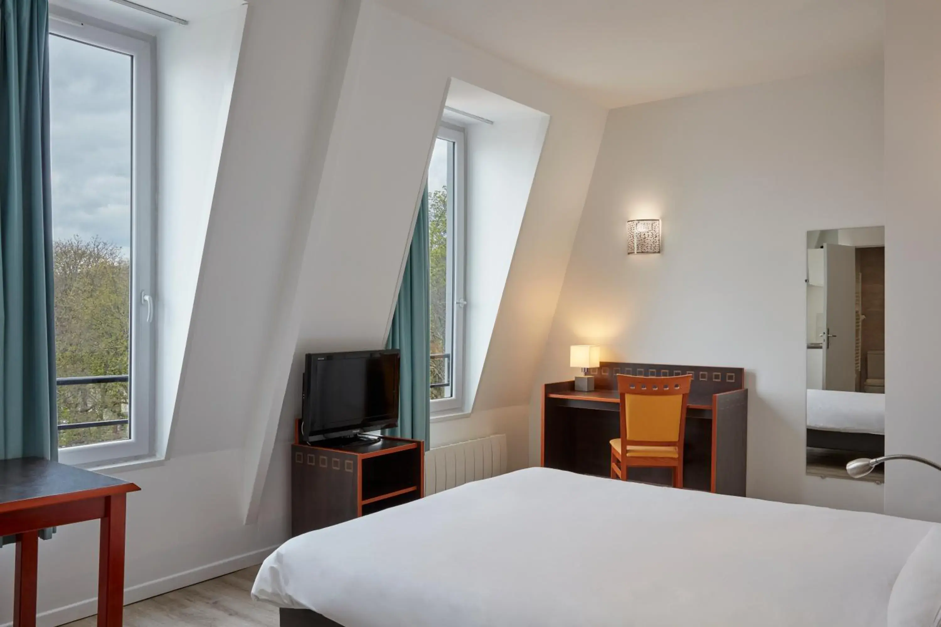 Bedroom, Bed in Aparthotel Adagio Access Paris Philippe Auguste Bedroom, Bed in Aparthotel Adagio Access Paris Philippe Auguste