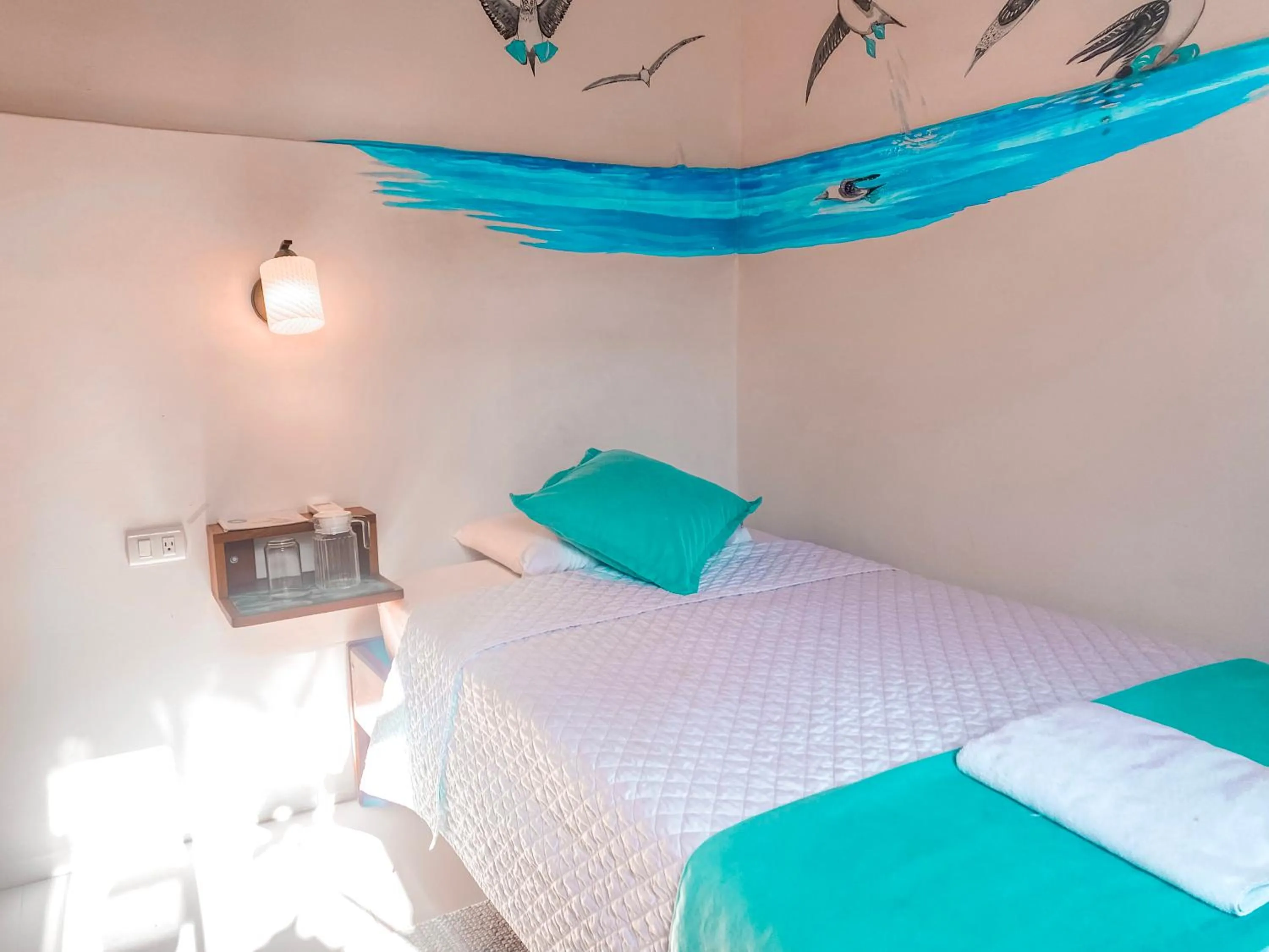 Bed in Hotel Coral Blanco with high speed internet Starlink and Galapagos Tour Operator