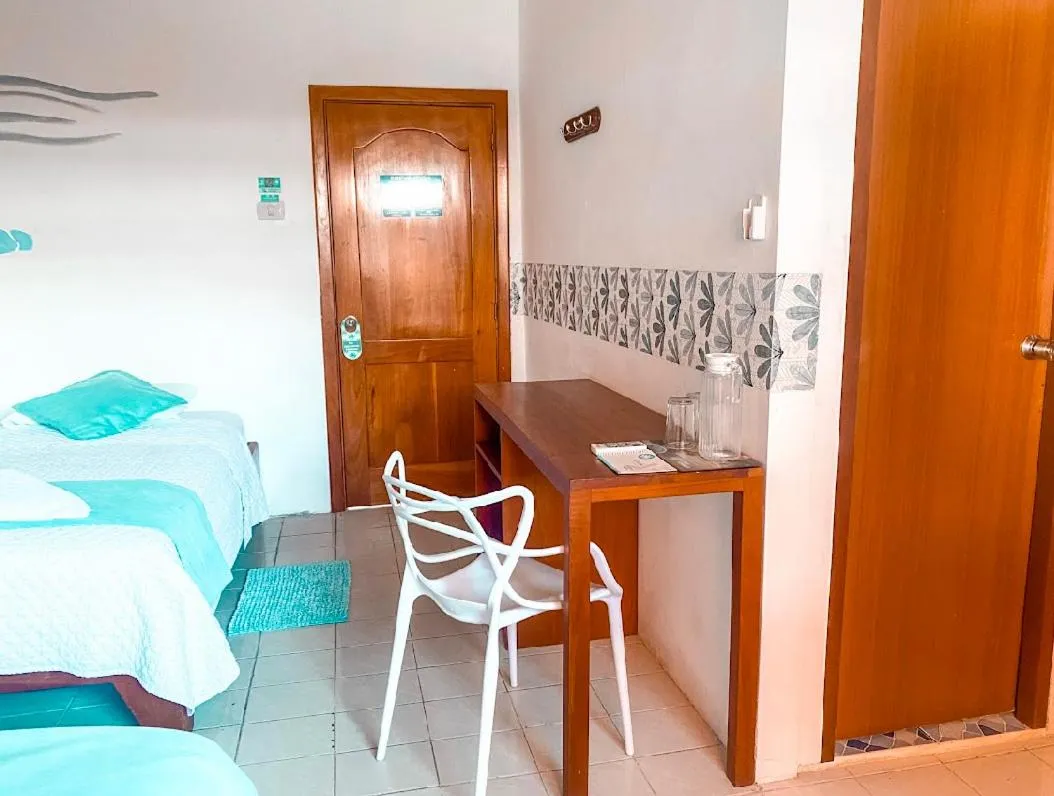 Seating area, Bed in Hotel Coral Blanco with high speed internet Starlink and Galapagos Tour Operator