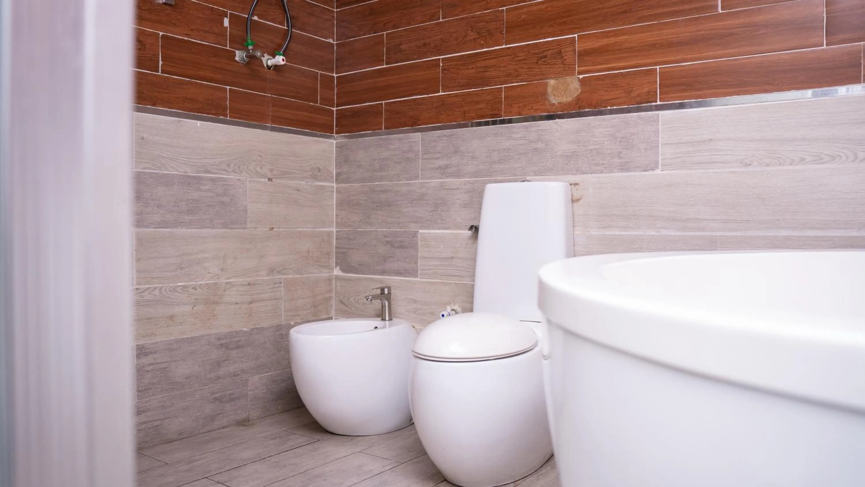 Toilet in Sese Cottage