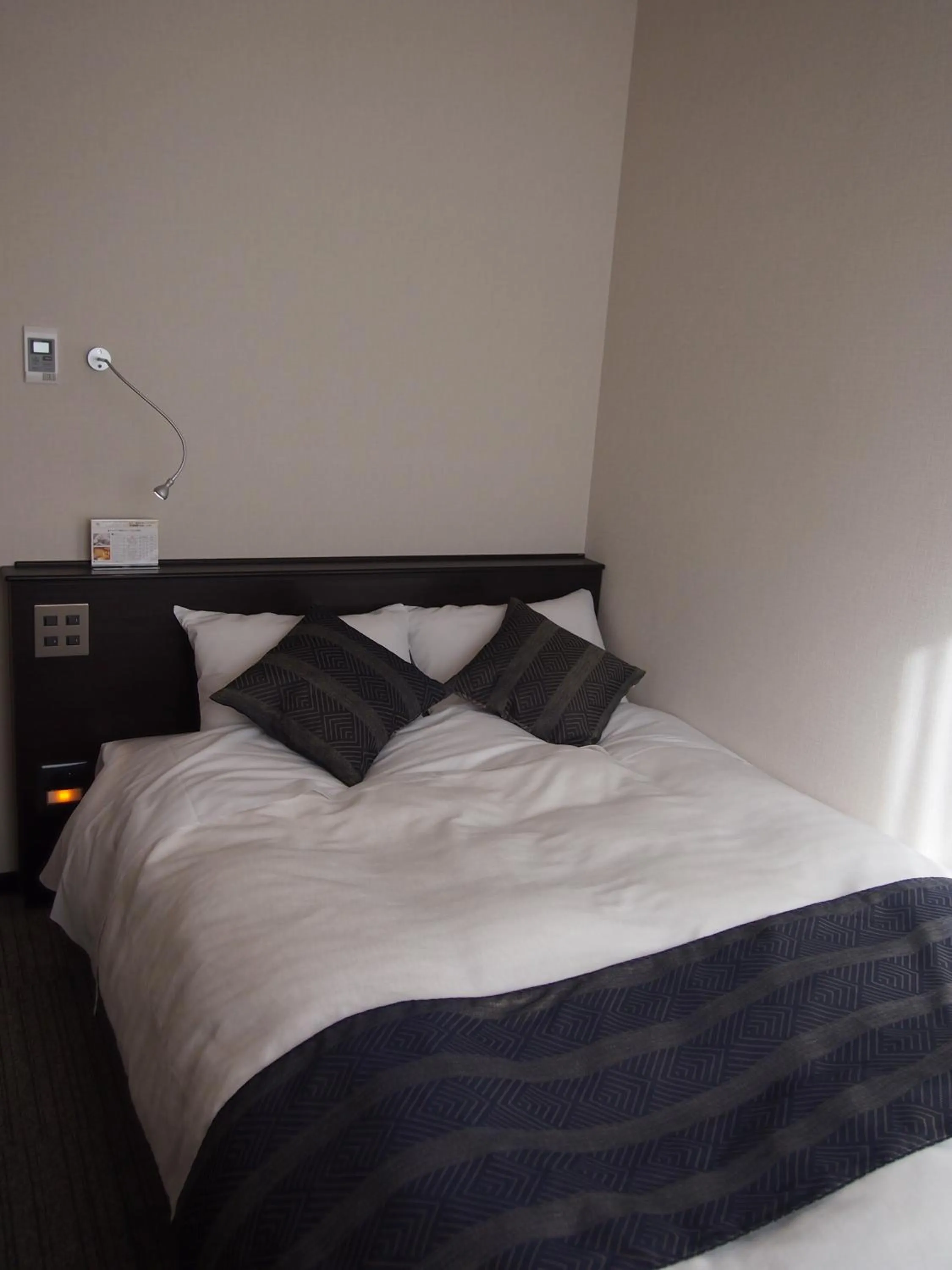 Bed in Silk Inn Kagoshima