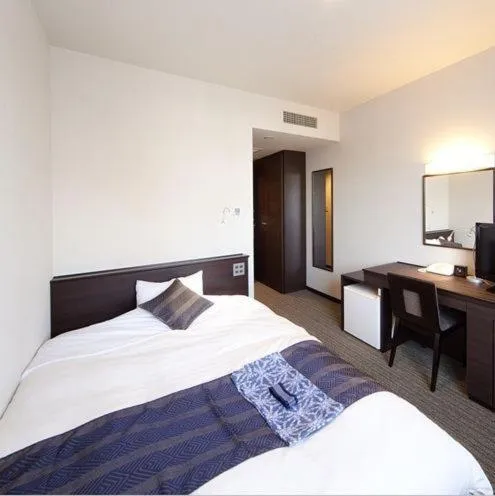 Photo of the whole room, Bed in Silk Inn Kagoshima