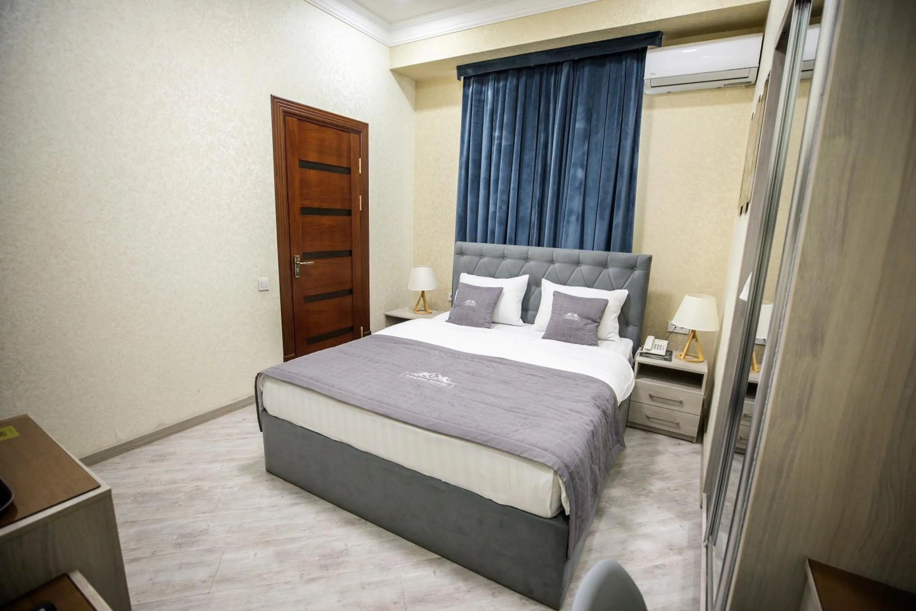 Photo of the whole room, Bed in Leader Hotel