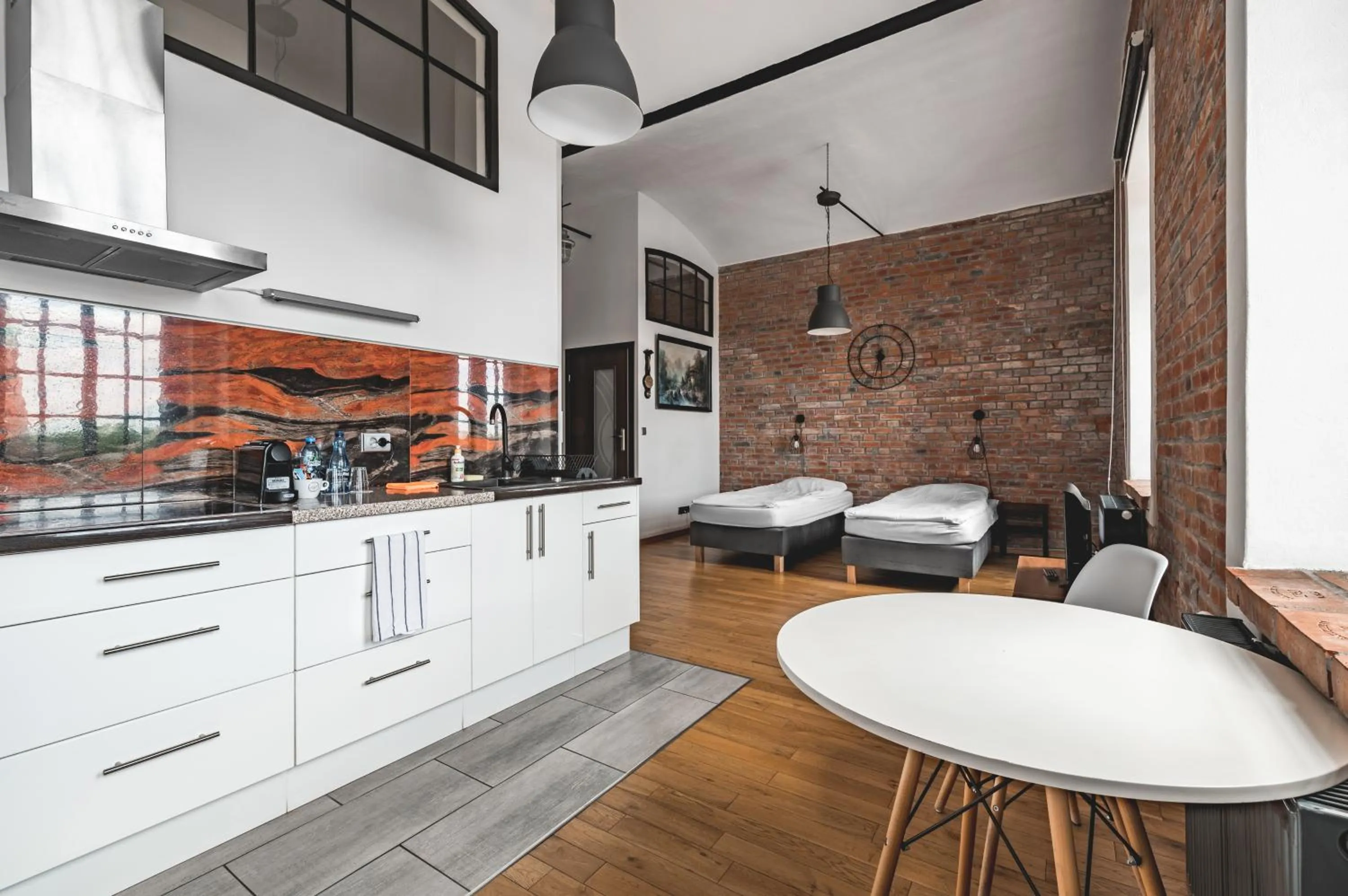 Kitchen or kitchenette in Aparthotel Stara Przędzalnia