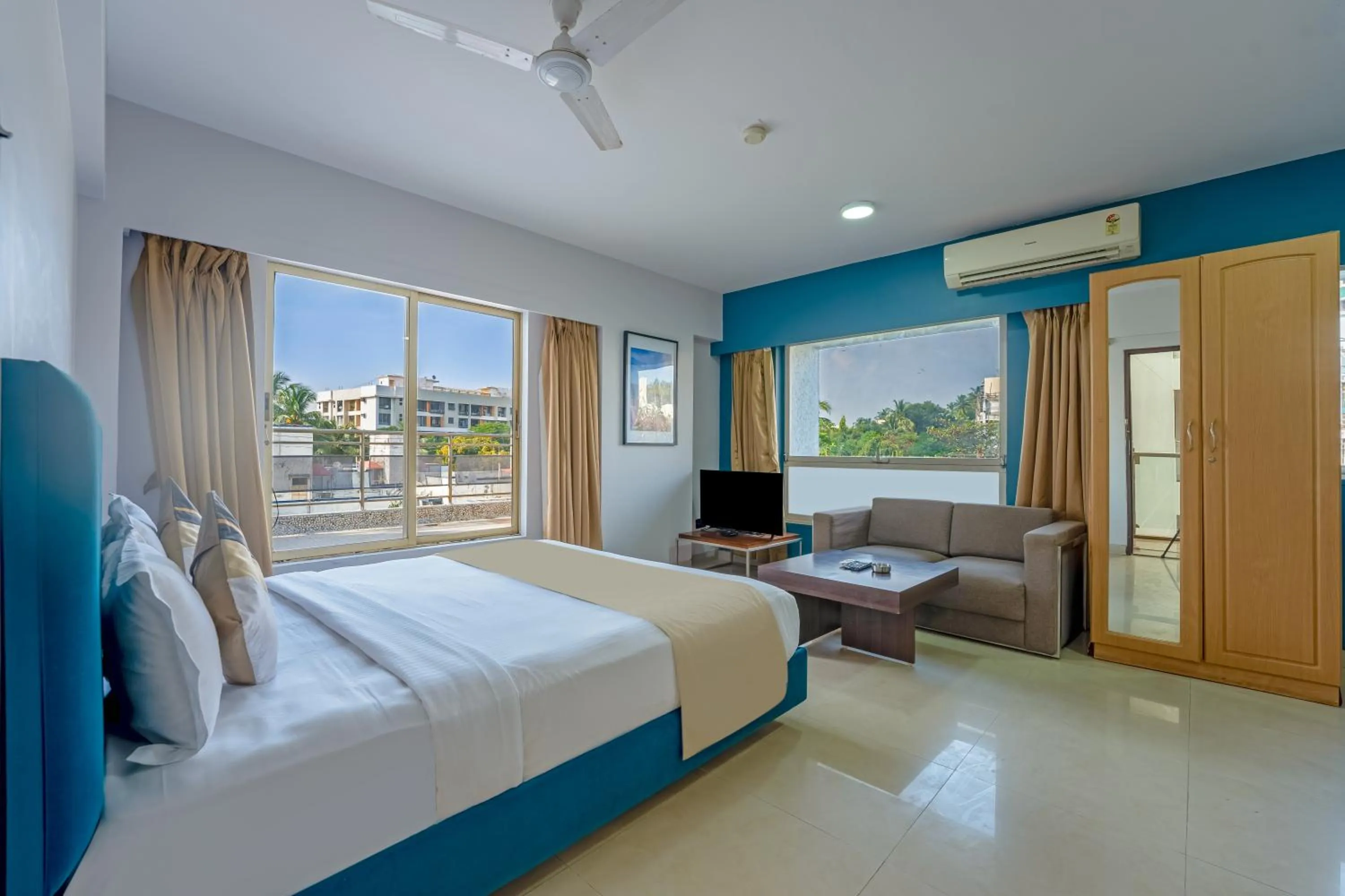 Bed in asar Landmark Suites Mumbai International Airport by Orion Hotels