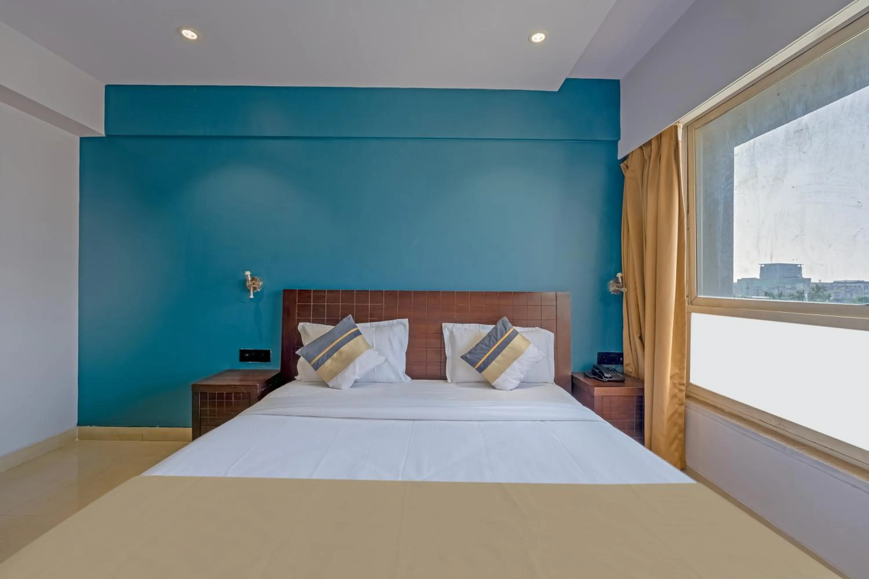 Bed in asar Landmark Suites Mumbai International Airport by Orion Hotels