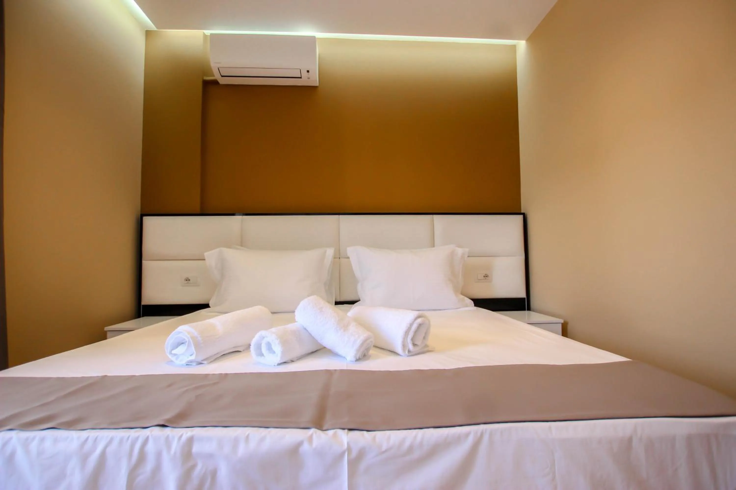 Bed in Brilant Luxury Apartment