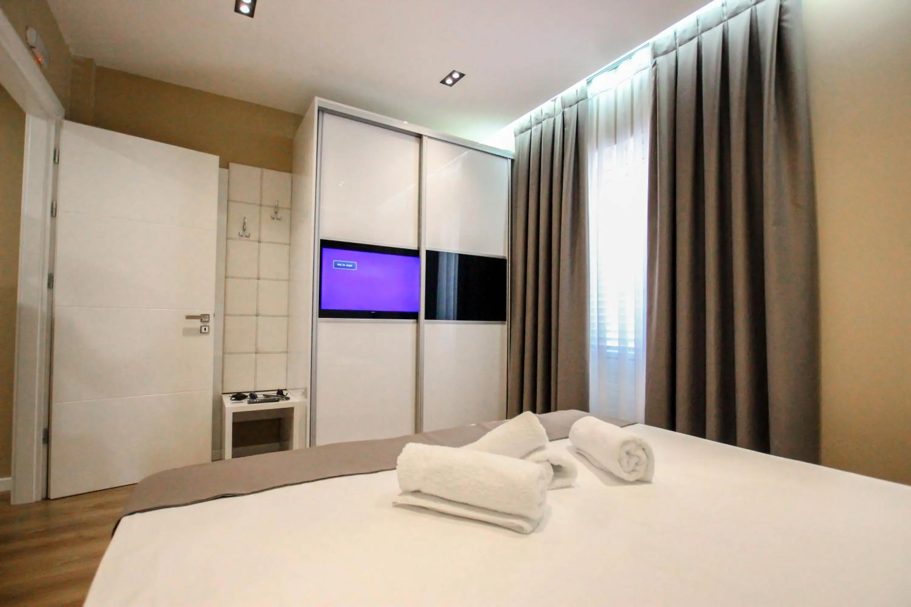 Bed in Brilant Luxury Apartment