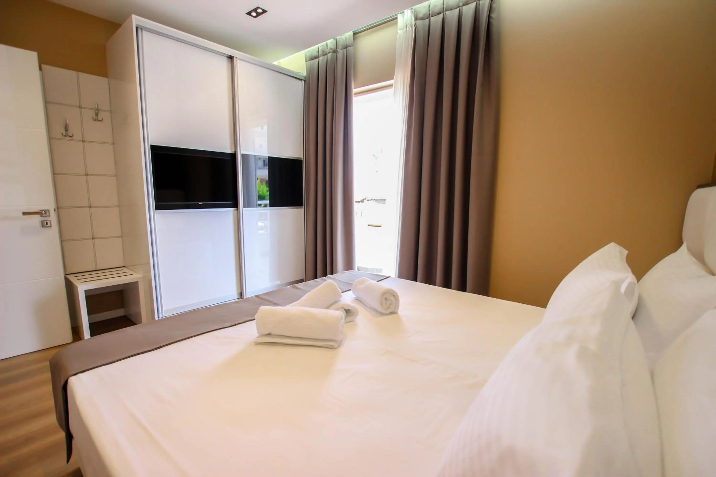 Bed in Brilant Luxury Apartment