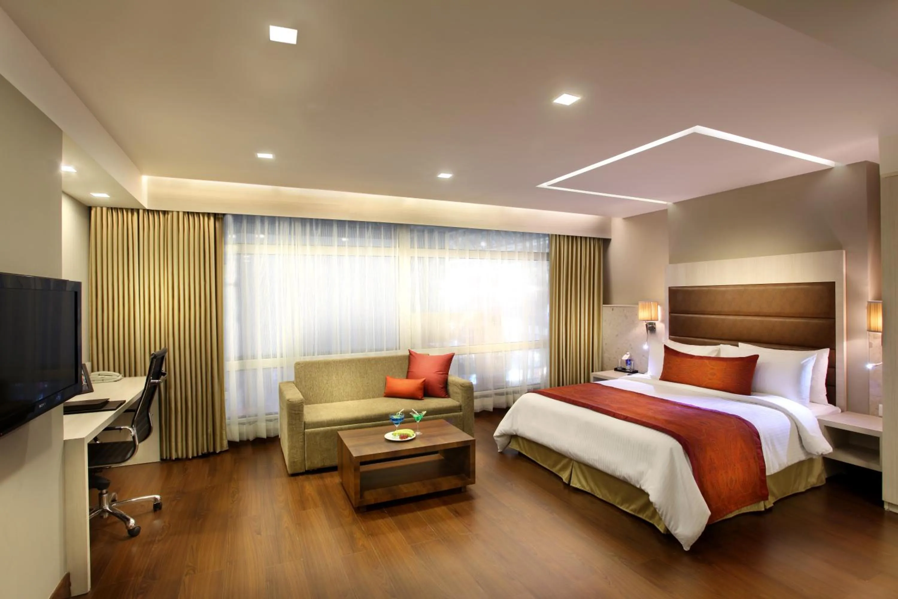 Photo of the whole room, Bed in Mahagun Sarovar Portico Suites