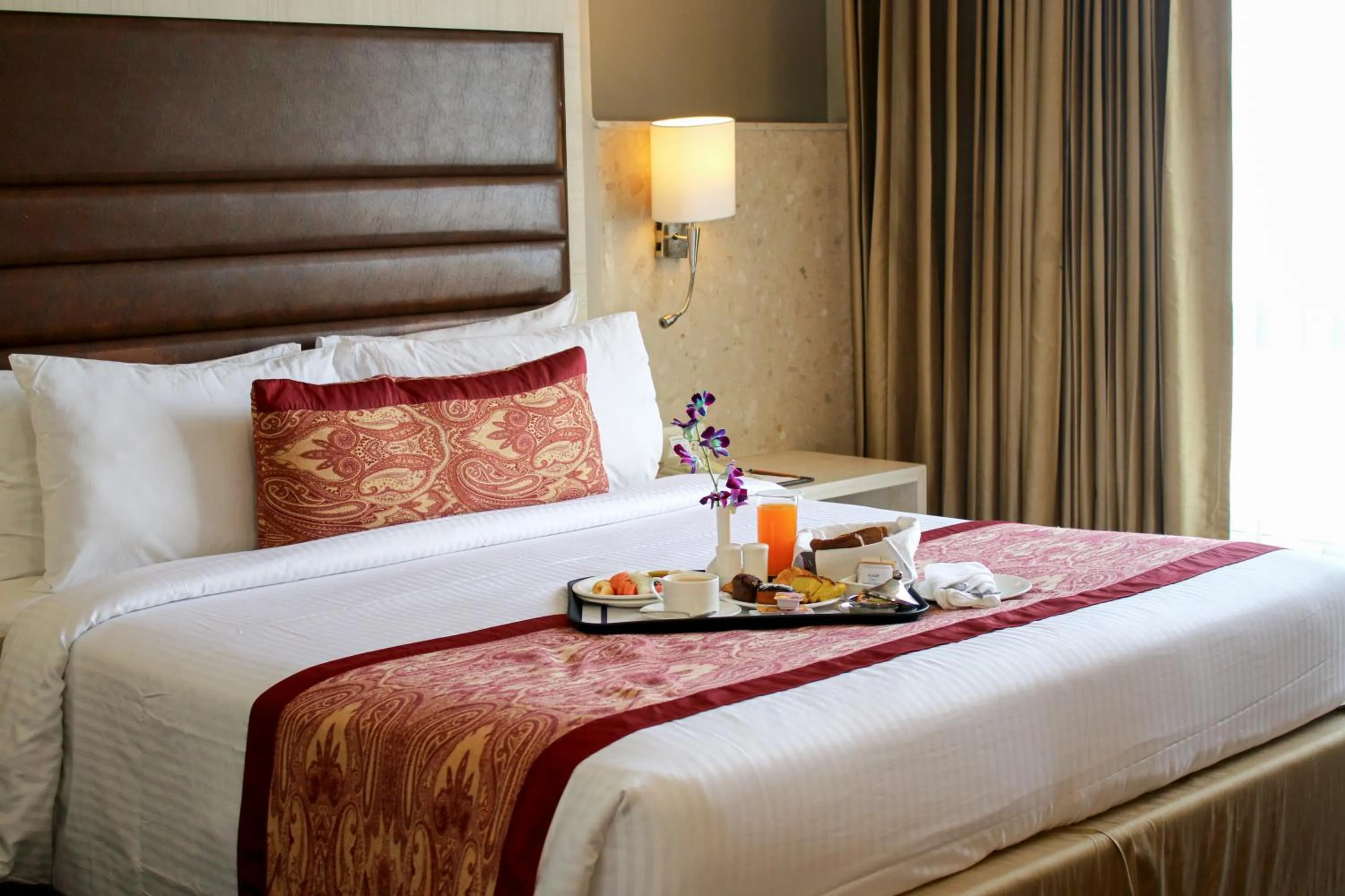 Photo of the whole room, Bed in Mahagun Sarovar Portico Suites