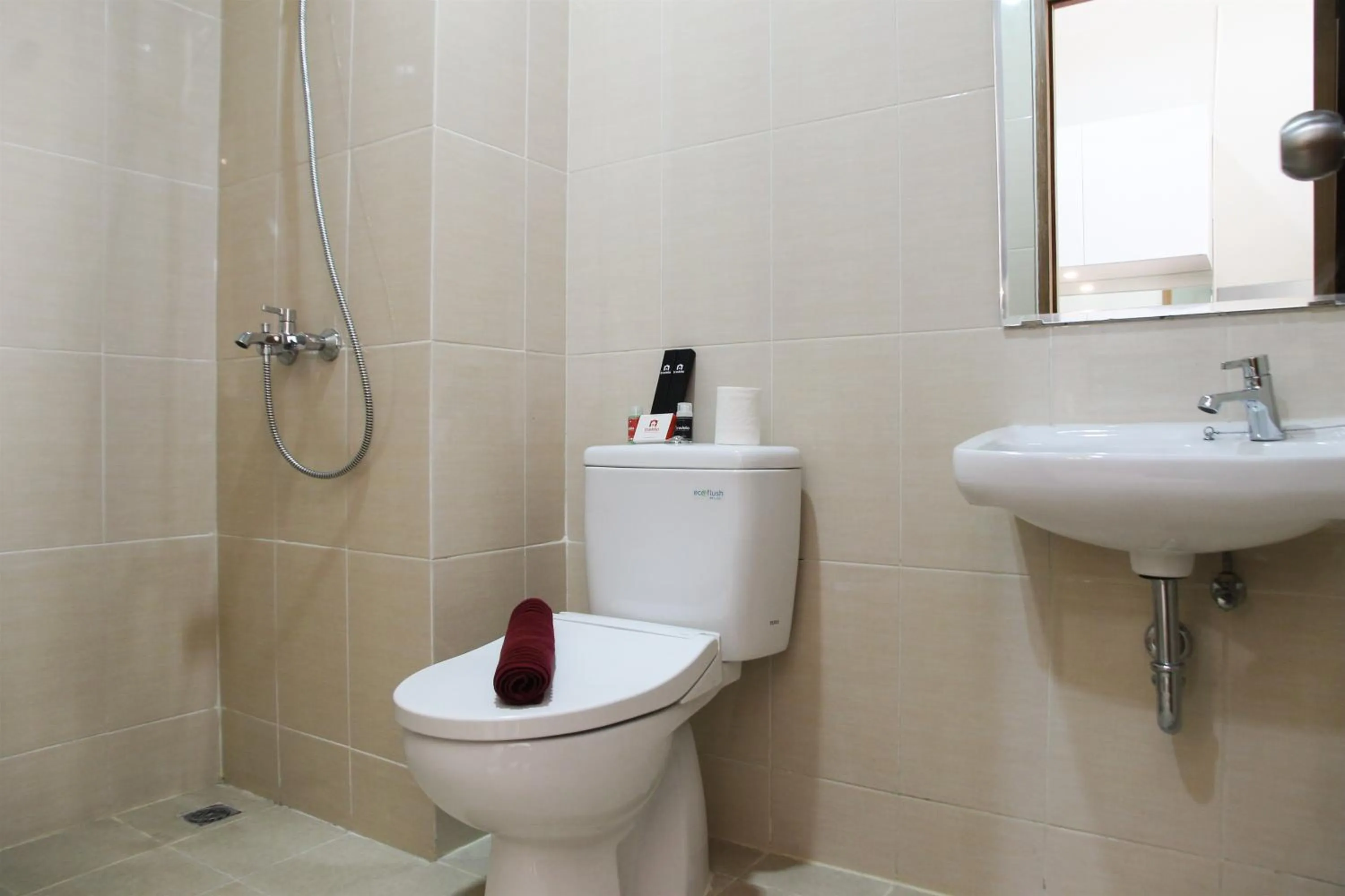 Bathroom in Comfy Studio Room The Oasis Cikarang Apartment By Travelio