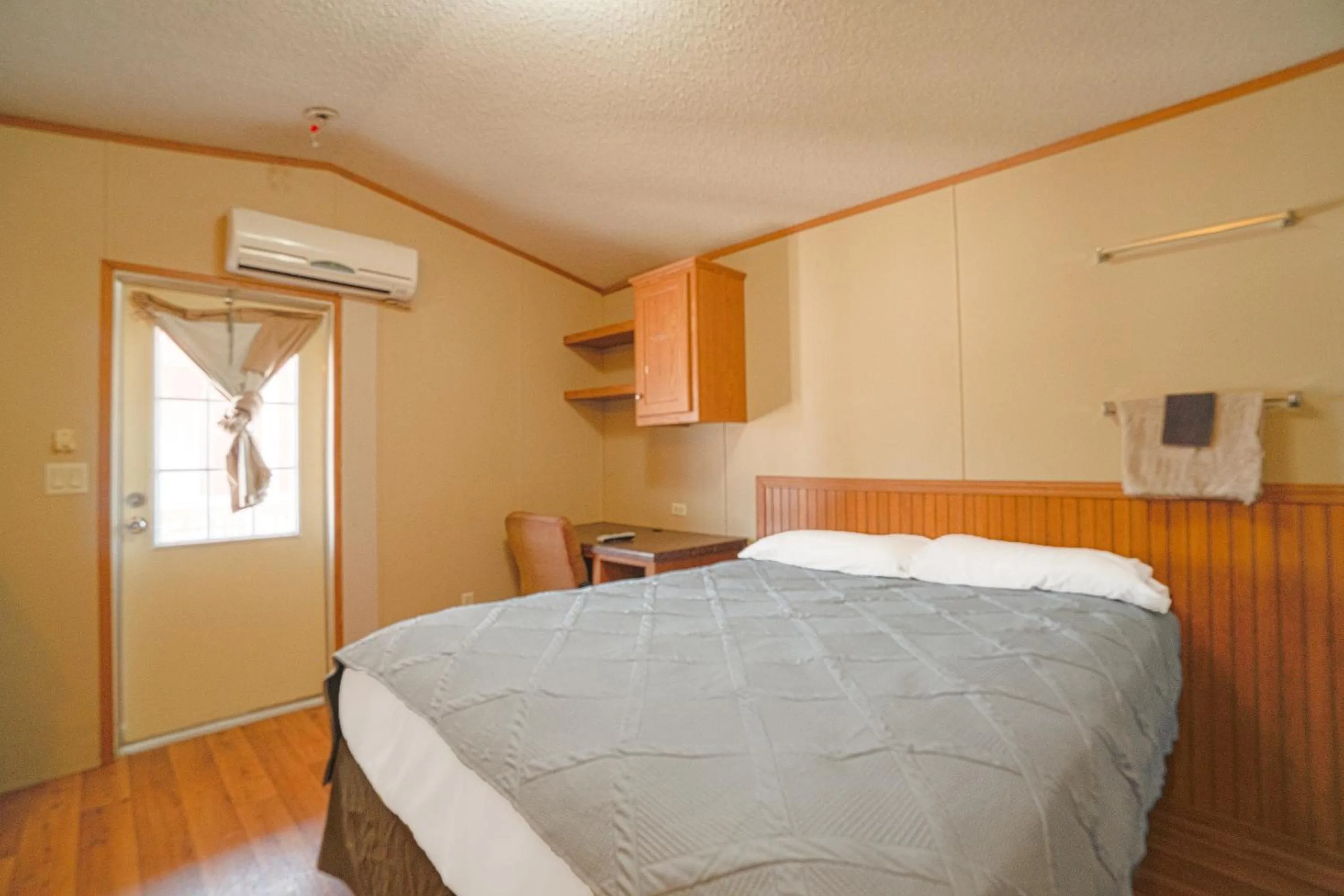 Bedroom in Grand Eagle Ford Lodge & RV Park