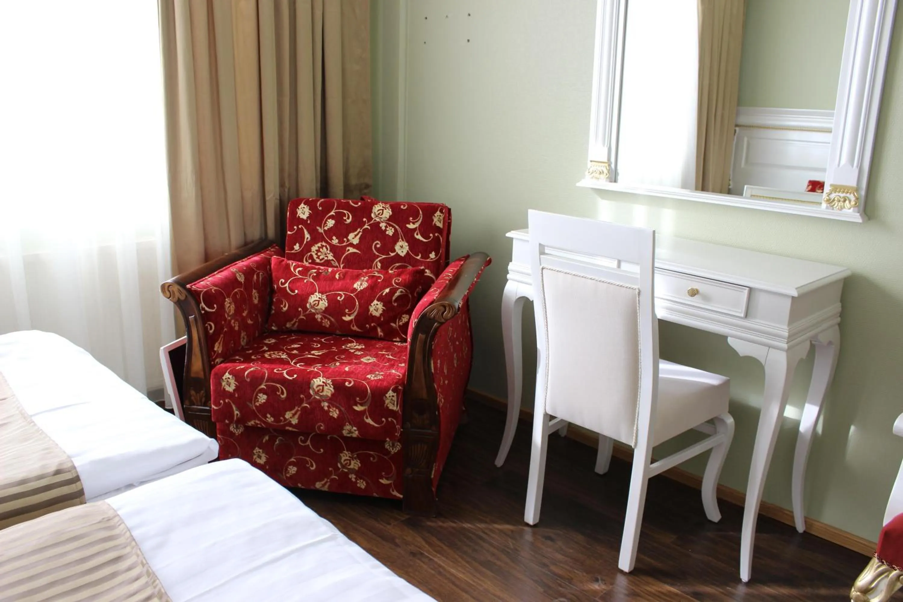 Seating area, Bed in Hotel Golden Dome Iisalmi