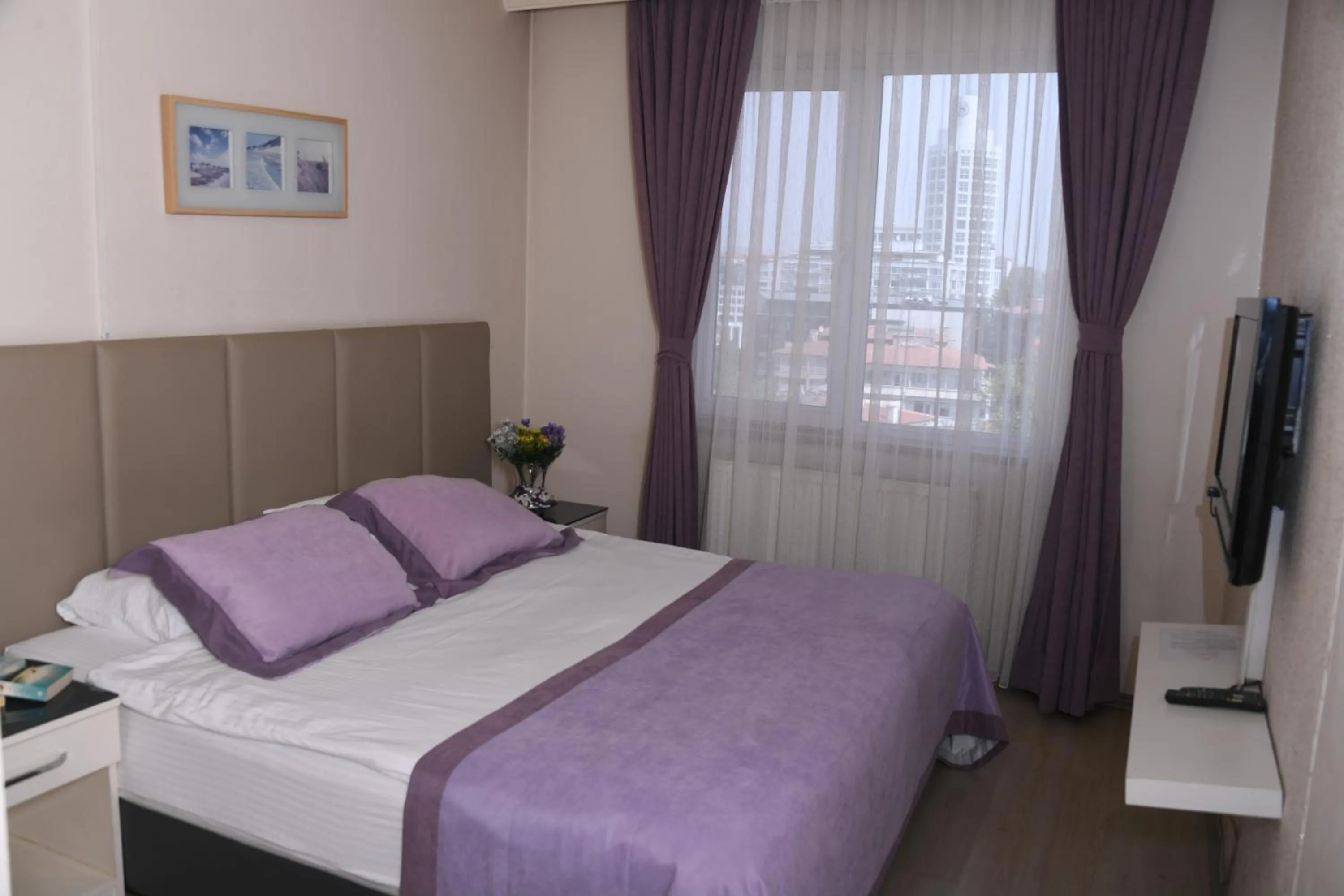 Communal lounge/ TV room, Bed in A Hotels & Suite