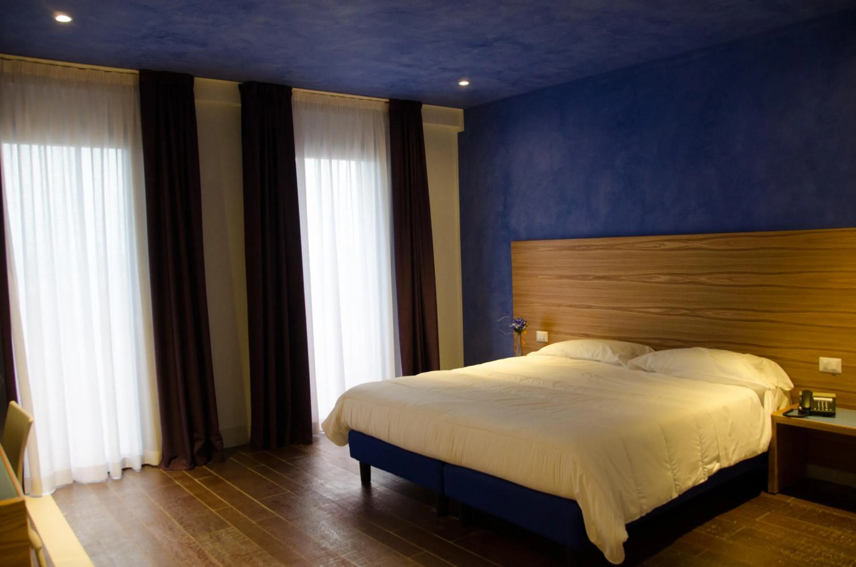 Bed in Hotel Zodiaco