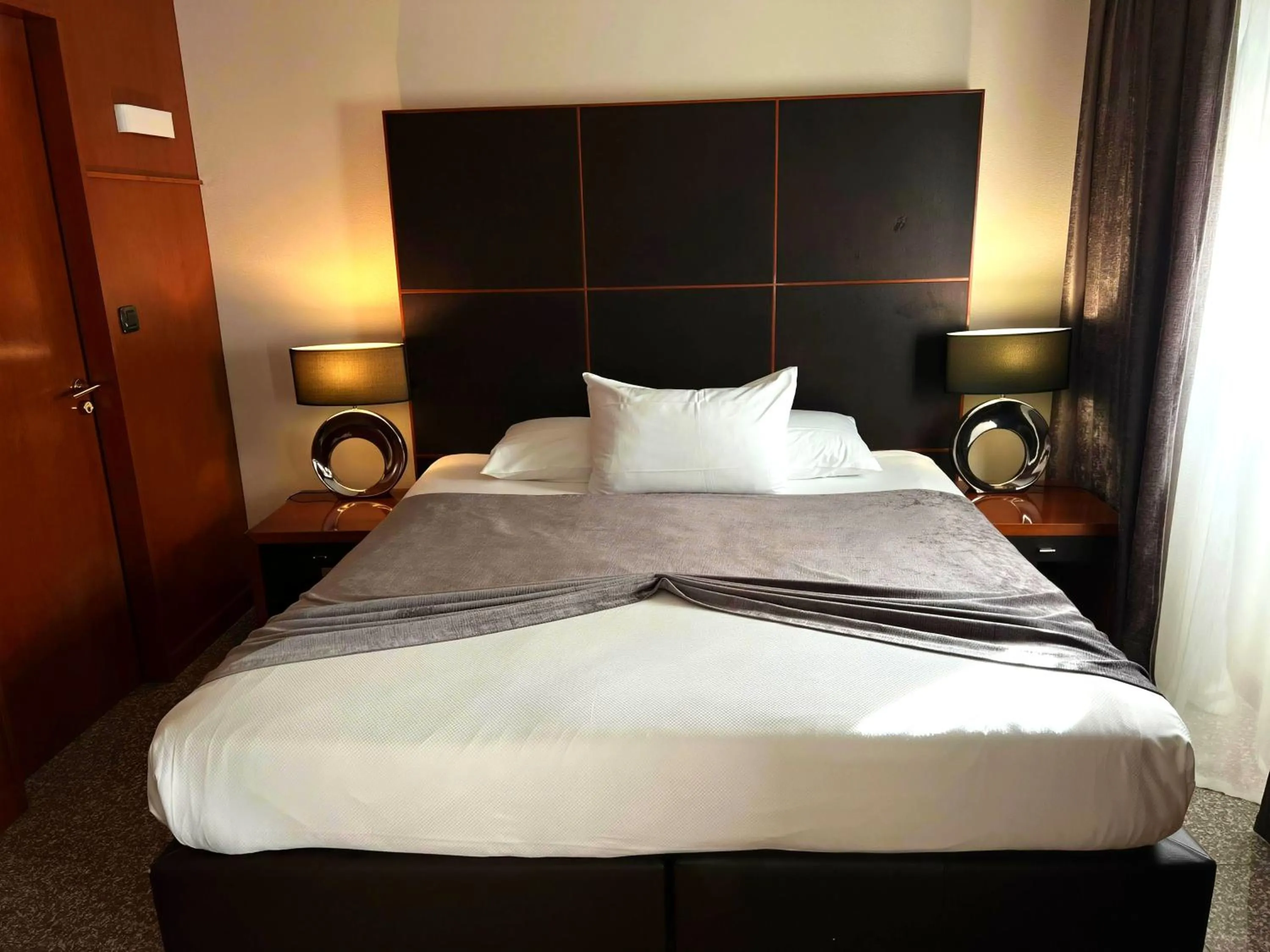 Bed in Goldstar Apartments & Suites