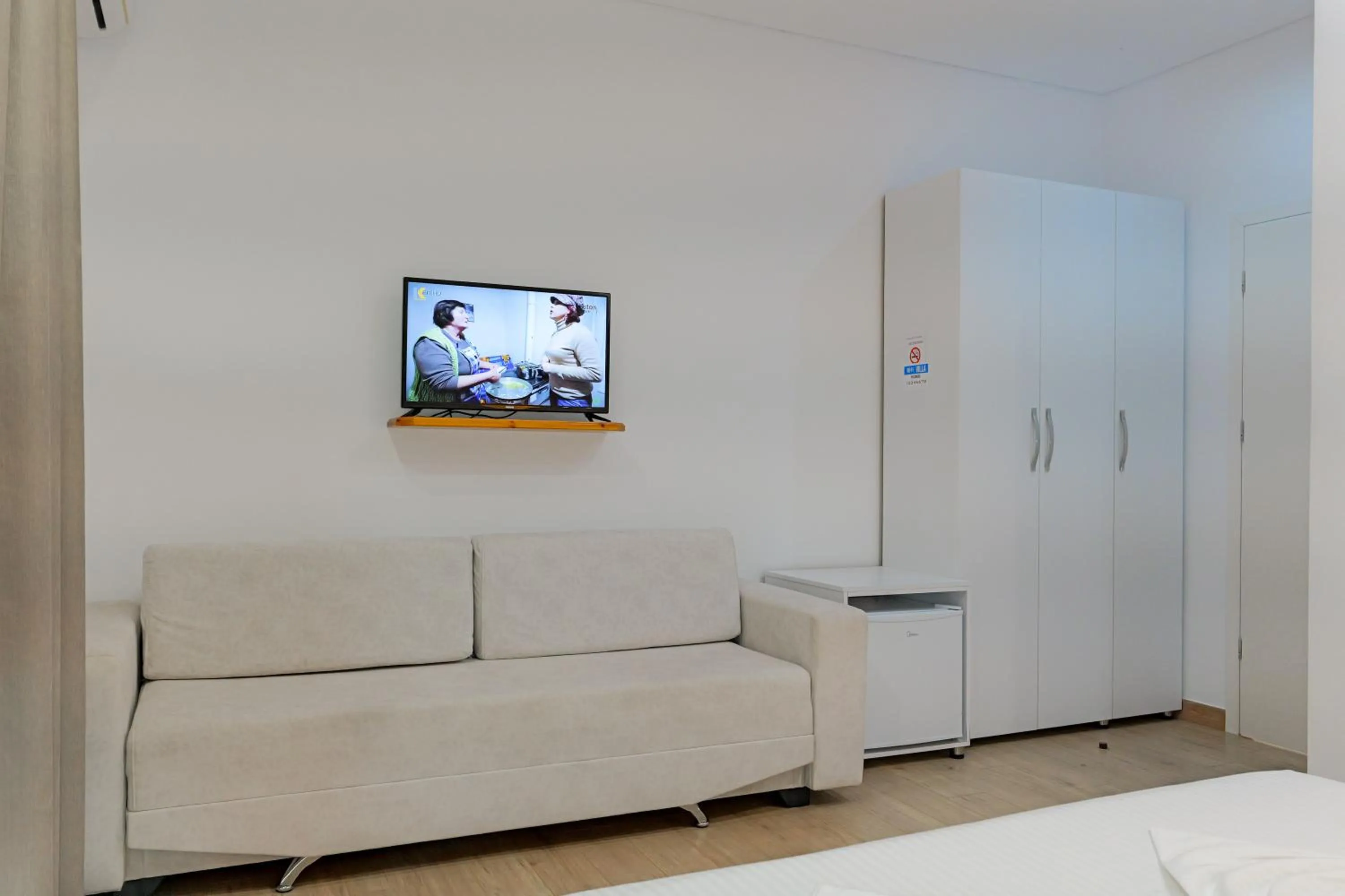 Seating area, Bed in Villa Juna Beach