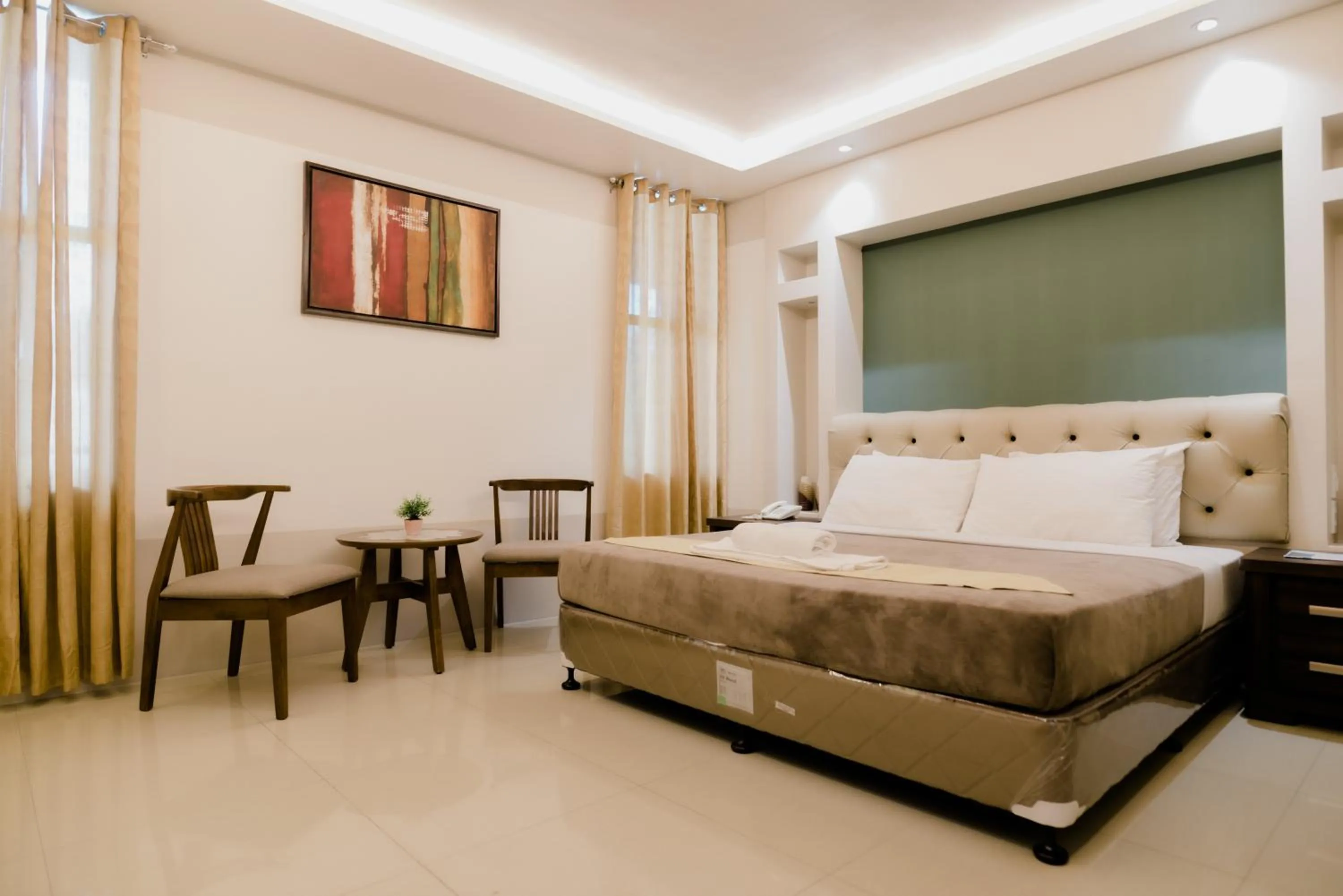 Photo of the whole room, Bed in The Horizon Suites and Arcade