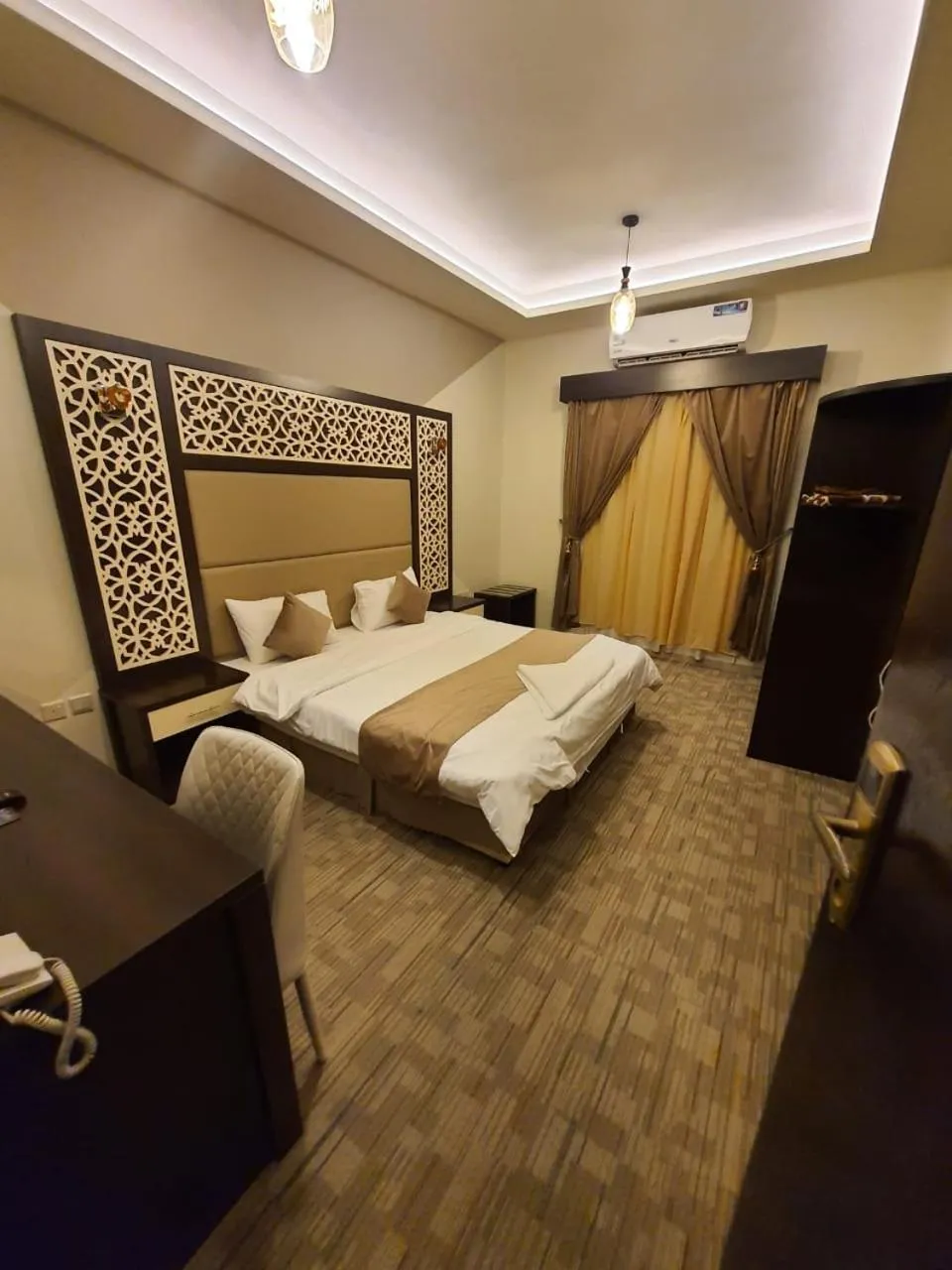 Bed in Arabian Palm Hotel