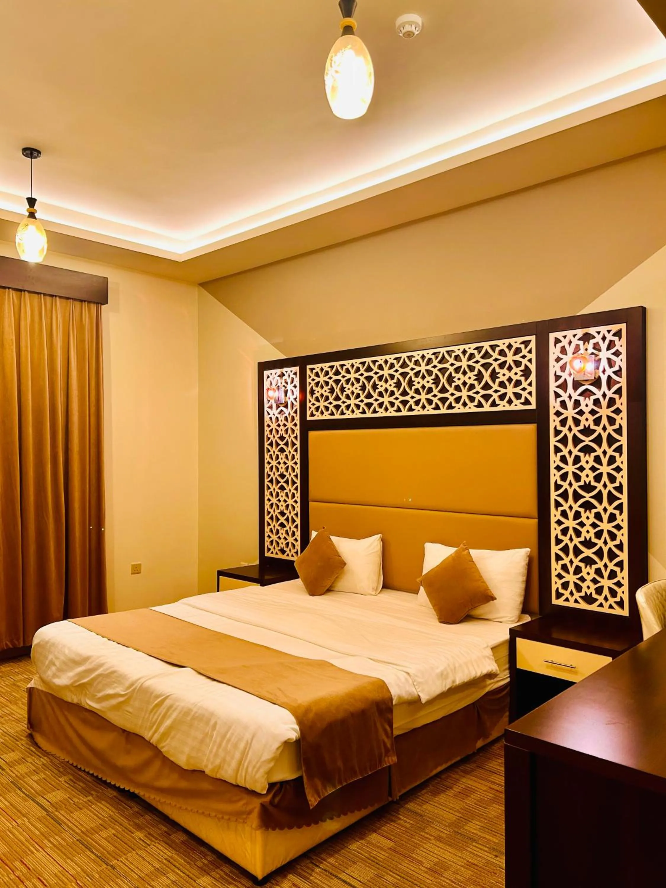Bed in Arabian Palm Hotel