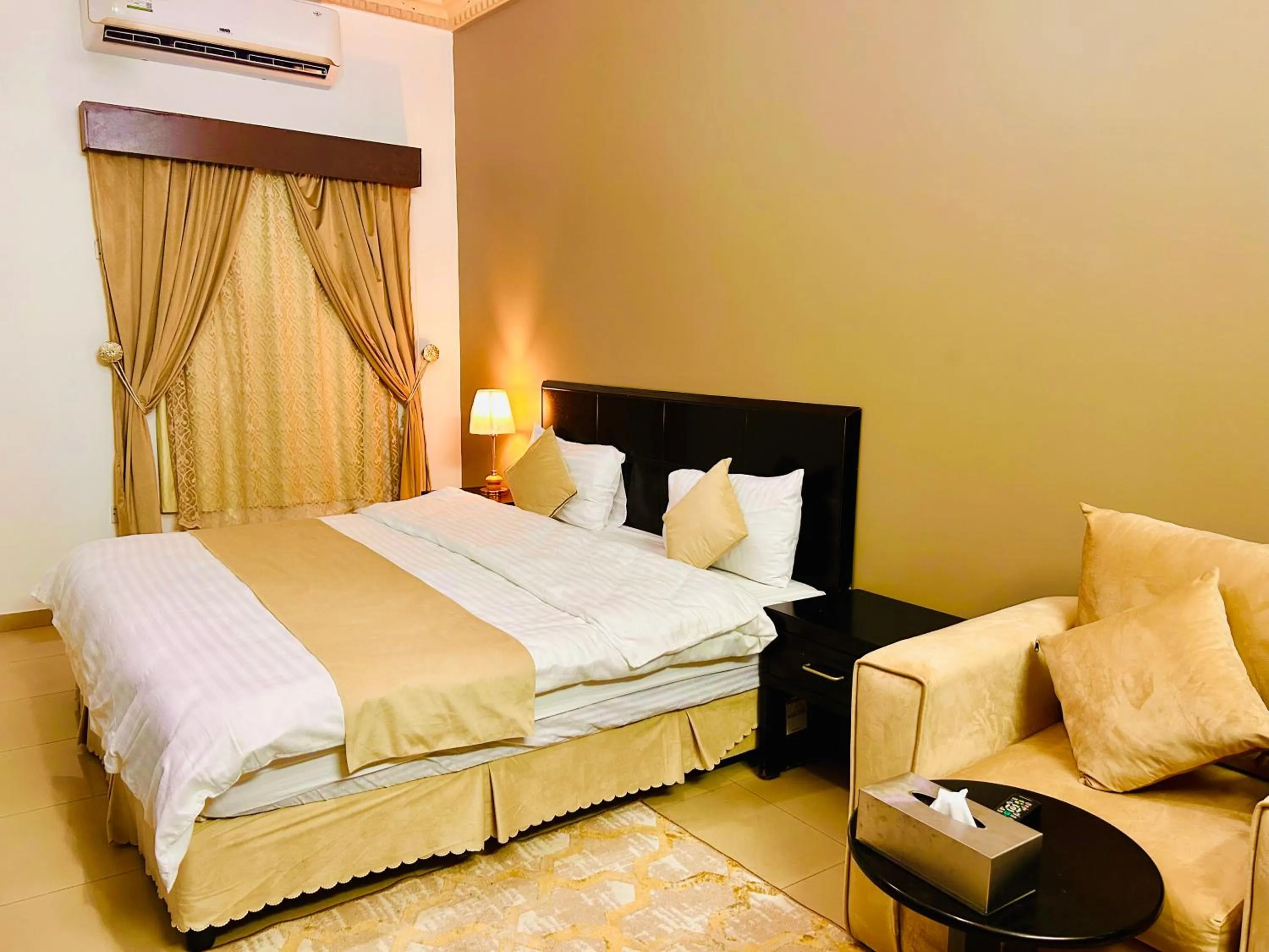 Bed in Arabian Palm Hotel