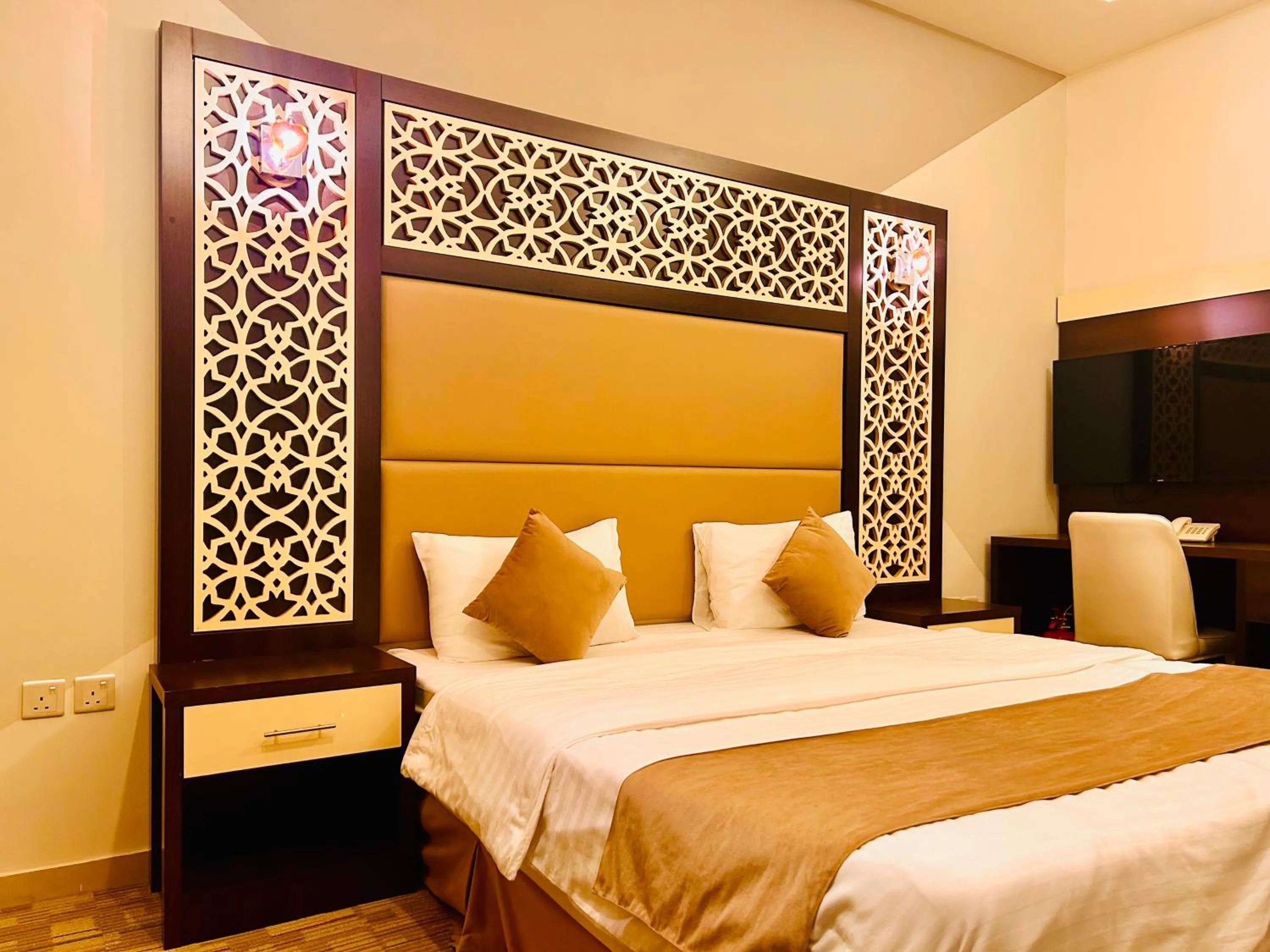 Bed in Arabian Palm Hotel
