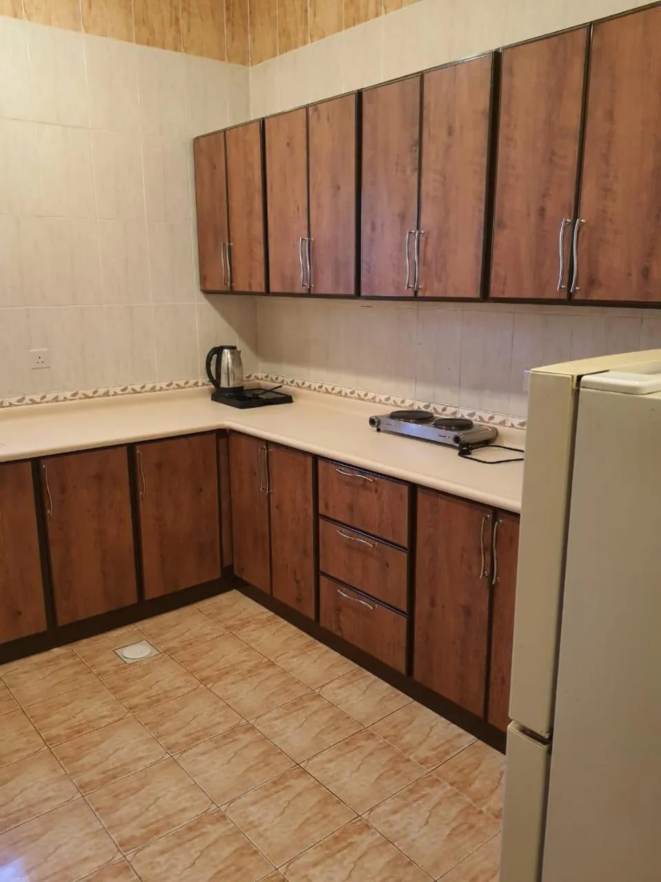 Kitchen or kitchenette in Arabian Palm Hotel