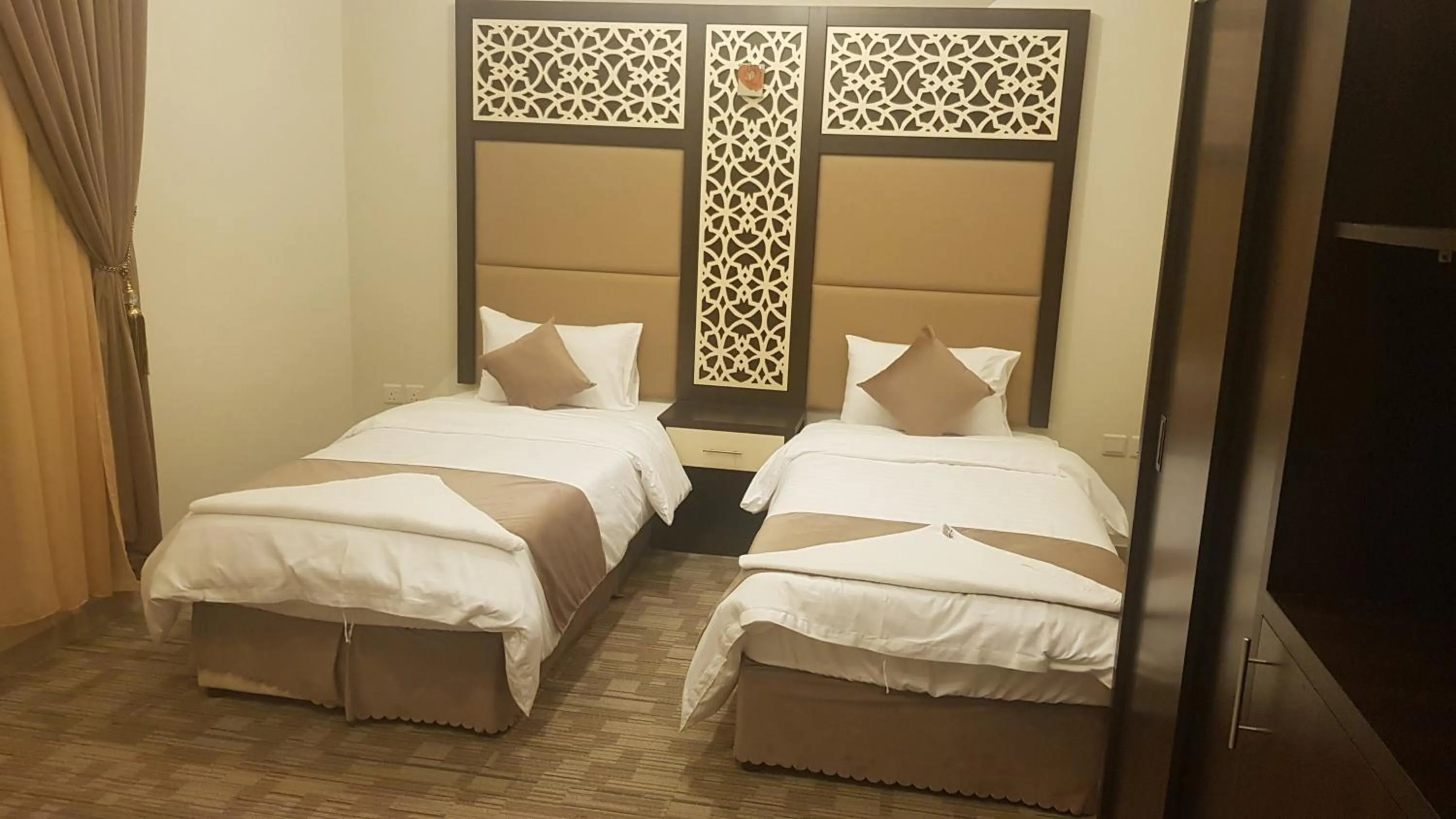Bed in Arabian Palm Hotel
