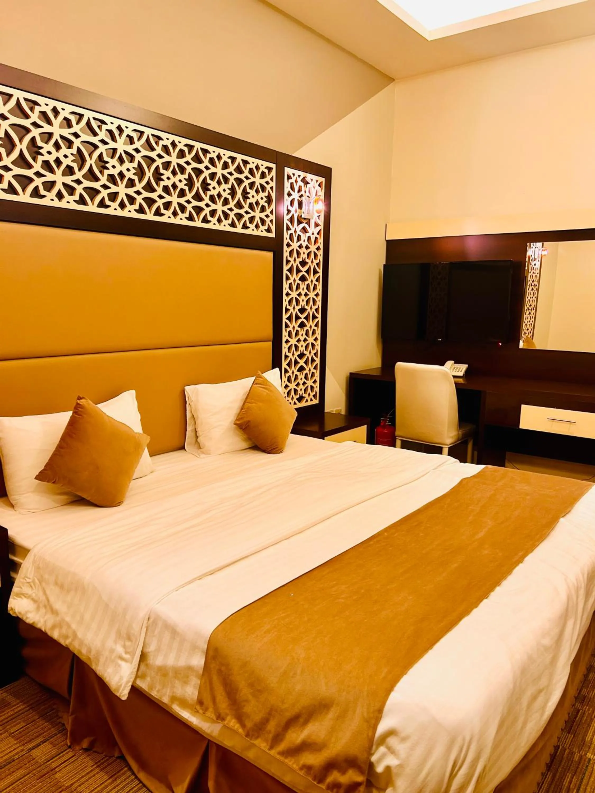 Bed in Arabian Palm Hotel