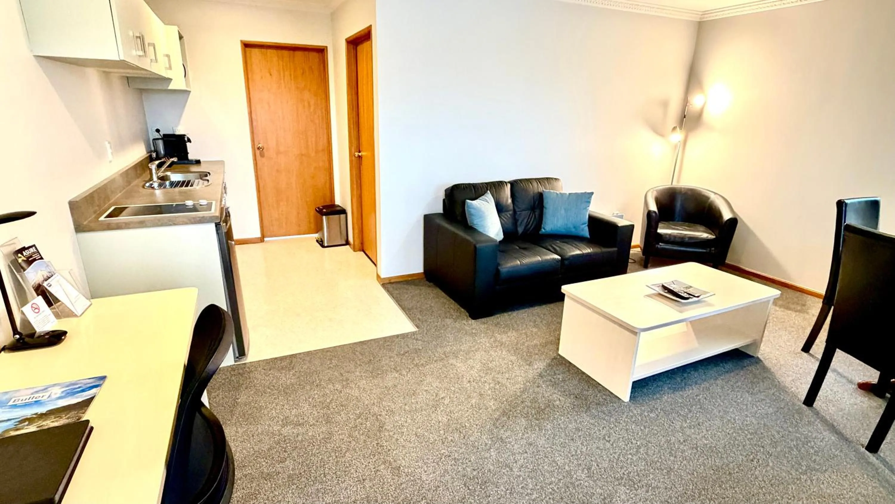 Living room in ASURE Chelsea Gateway Motor Lodge