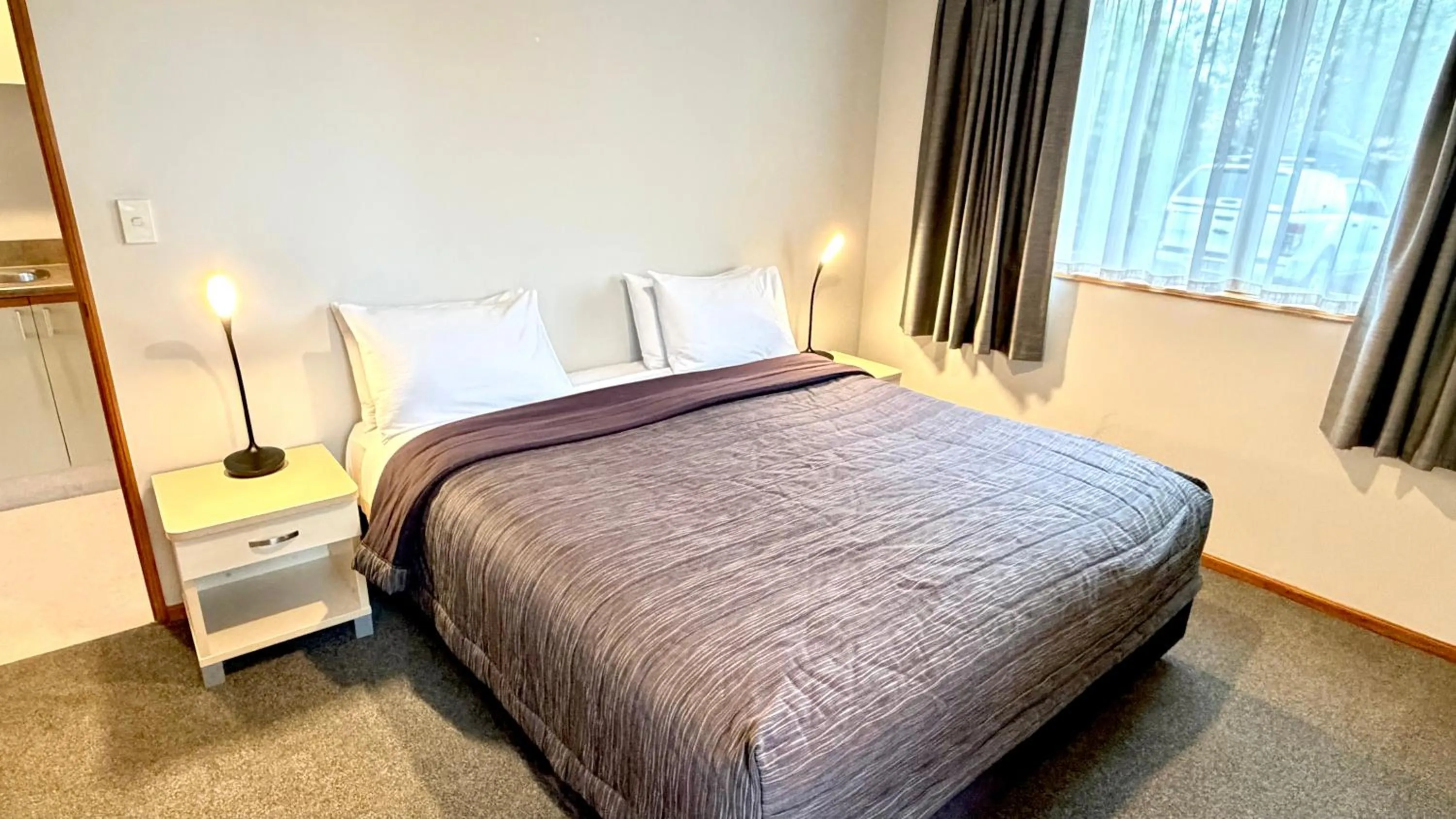 Bed in ASURE Chelsea Gateway Motor Lodge