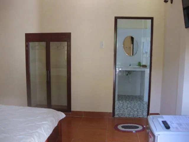 Toilet, Bed in Cocosand Hotel