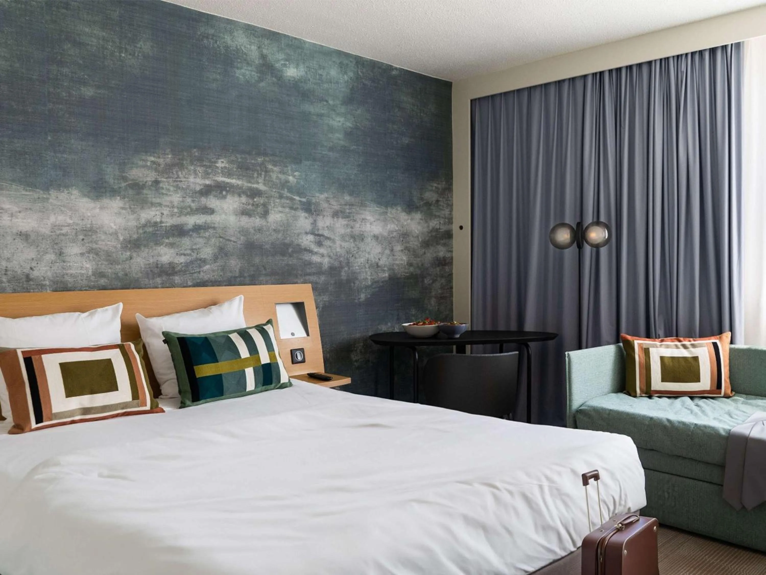 Family Room with Double Bed and Sofa  in Novotel Bayeux