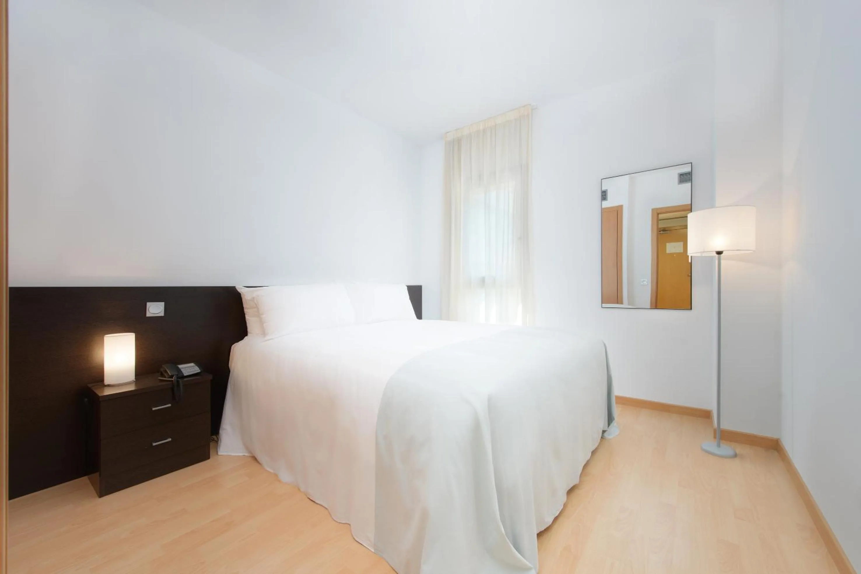 Bedroom, Bed in Madrid Airport Suites, Affiliated by Meliá