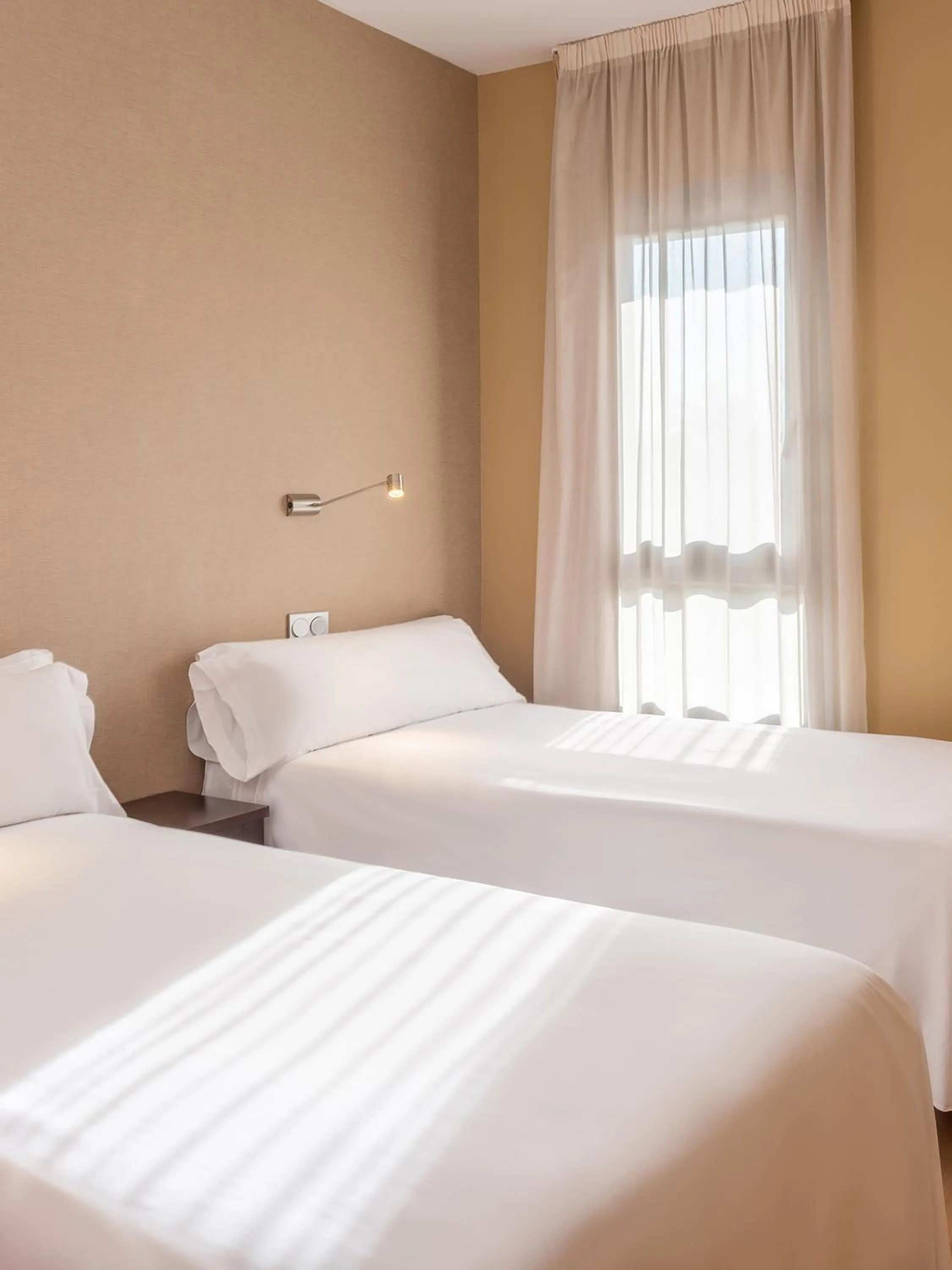 Bedroom, Bed in Madrid Airport Suites, Affiliated by Meliá