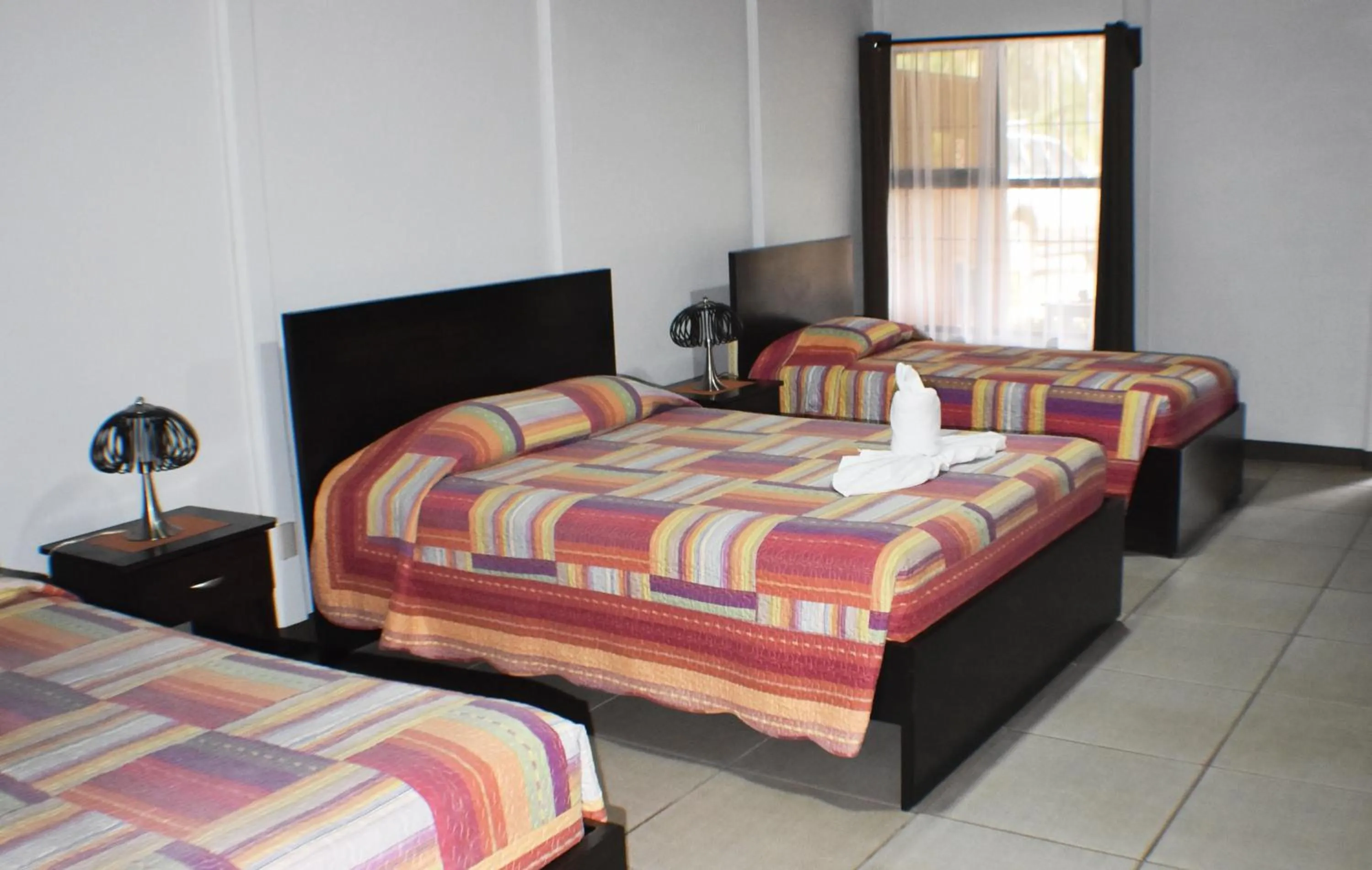 Bed in Hotel Arenal Country Inn