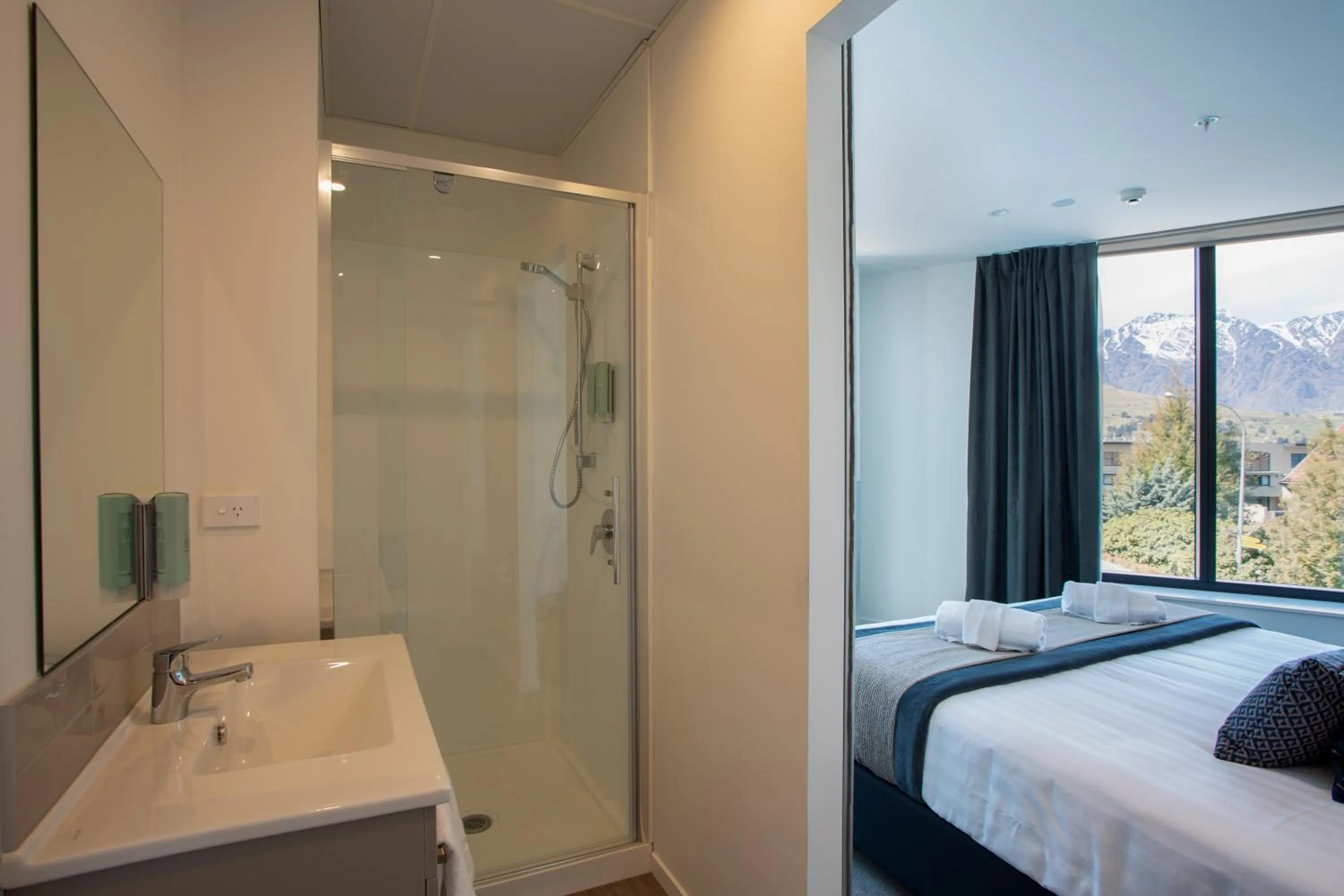 Bathroom, Bed in Ramada by Wyndham Queenstown Central