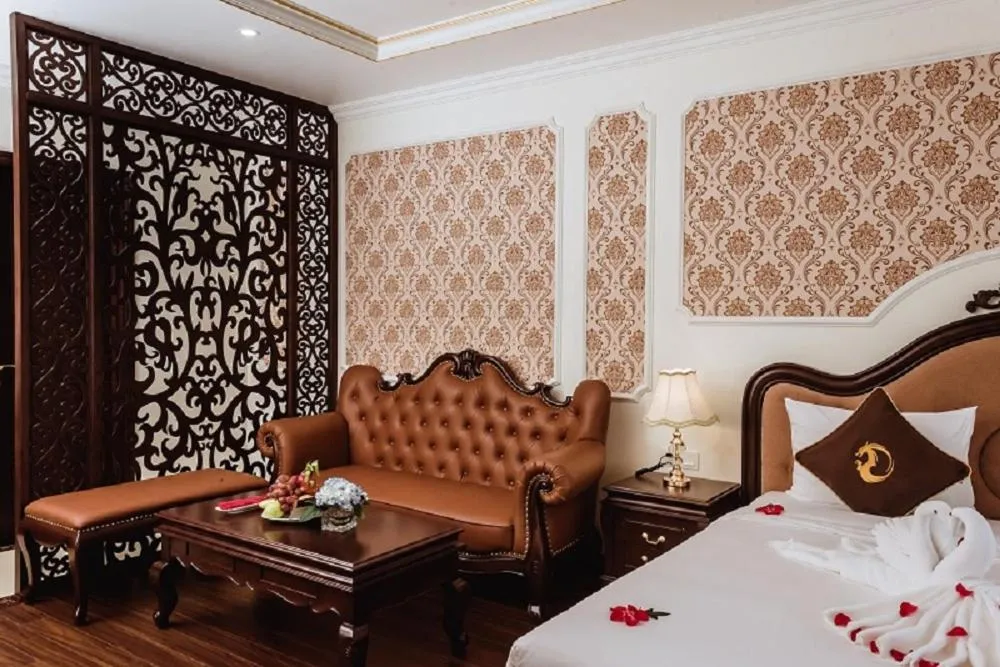 Seating area, Bed in Dragon Legend Hotel