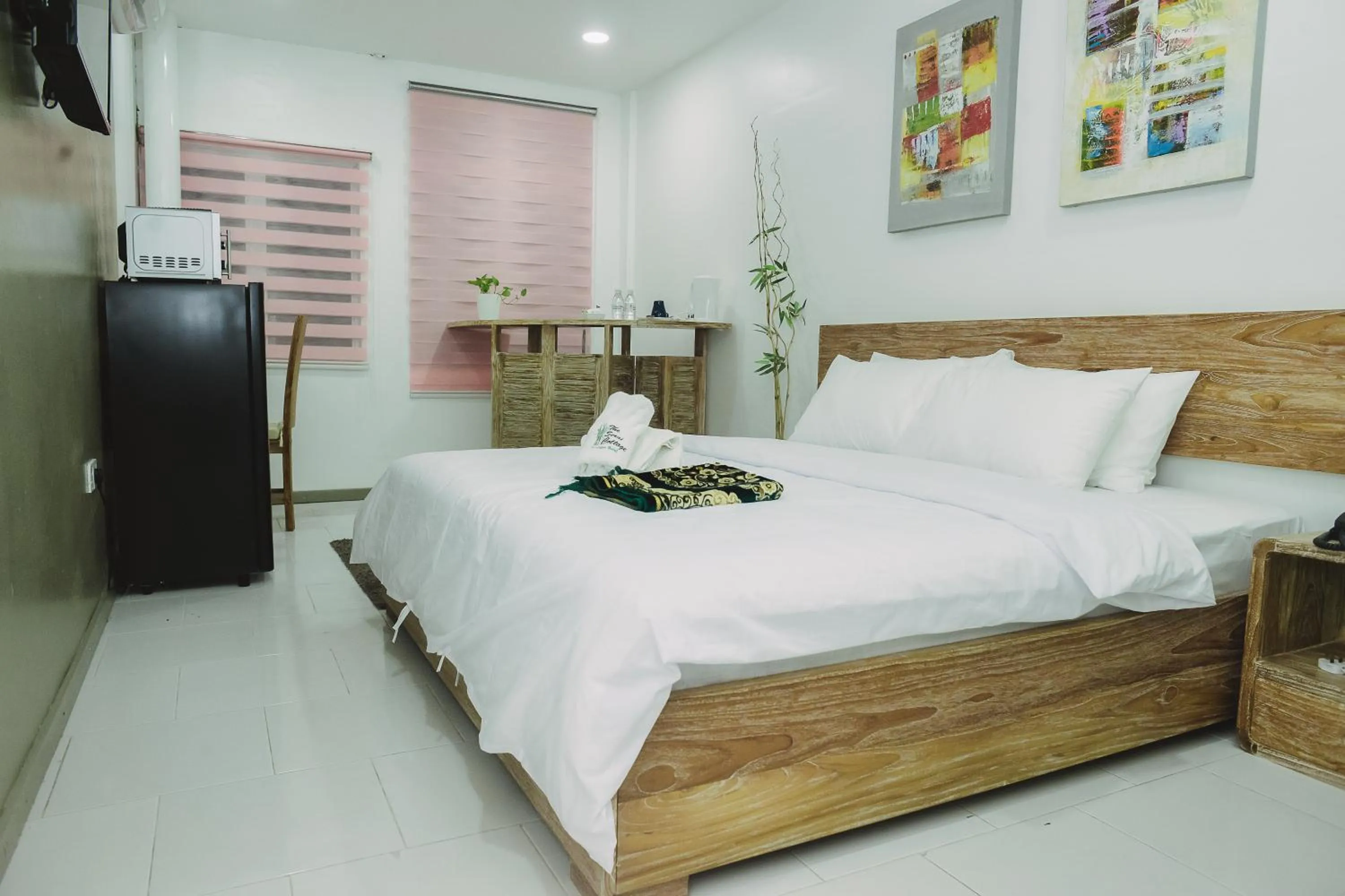 Bed in The Serai Cottage Downtown Hotel