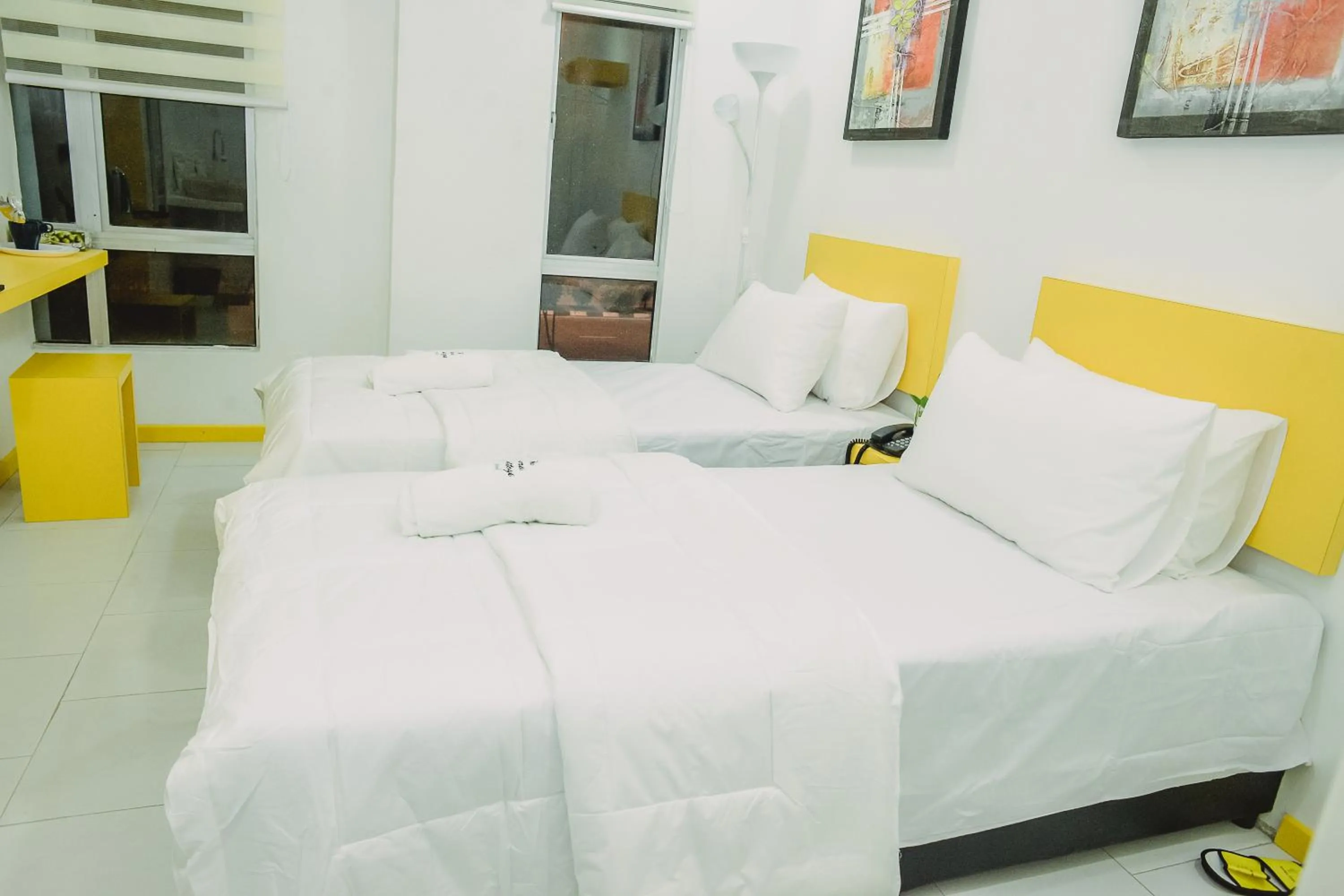 Bed in The Serai Cottage Downtown Hotel