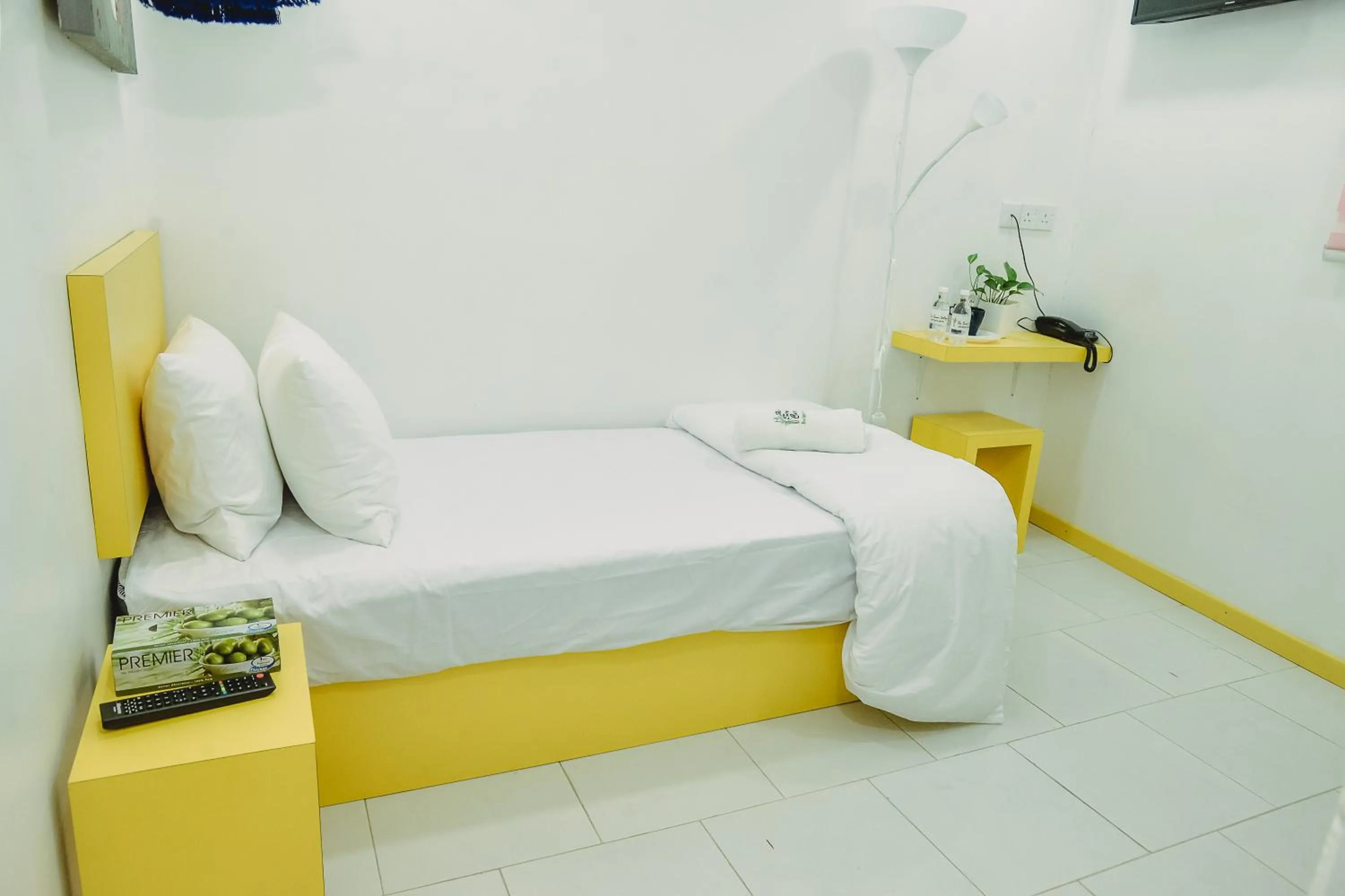 Bed in The Serai Cottage Downtown Hotel