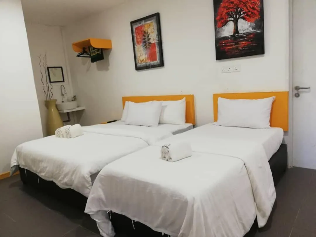 Bed in The Serai Cottage Downtown Hotel