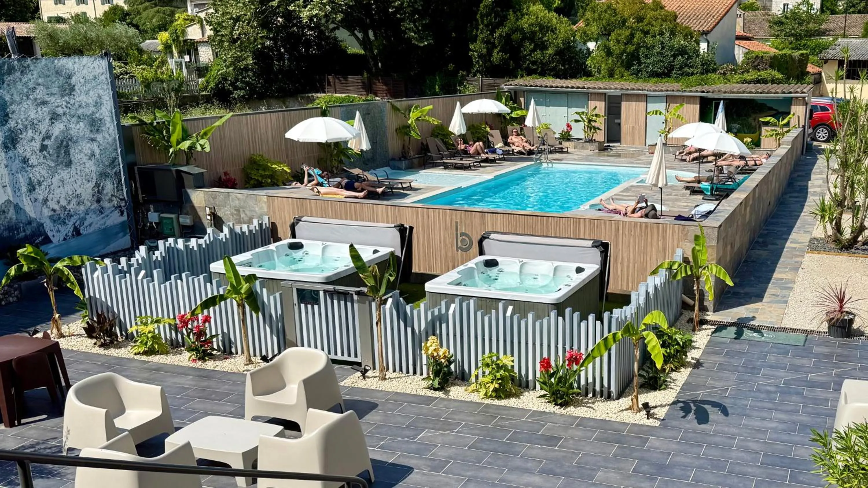 Swimming pool in Logis Hôtel Restaurant Bellevue