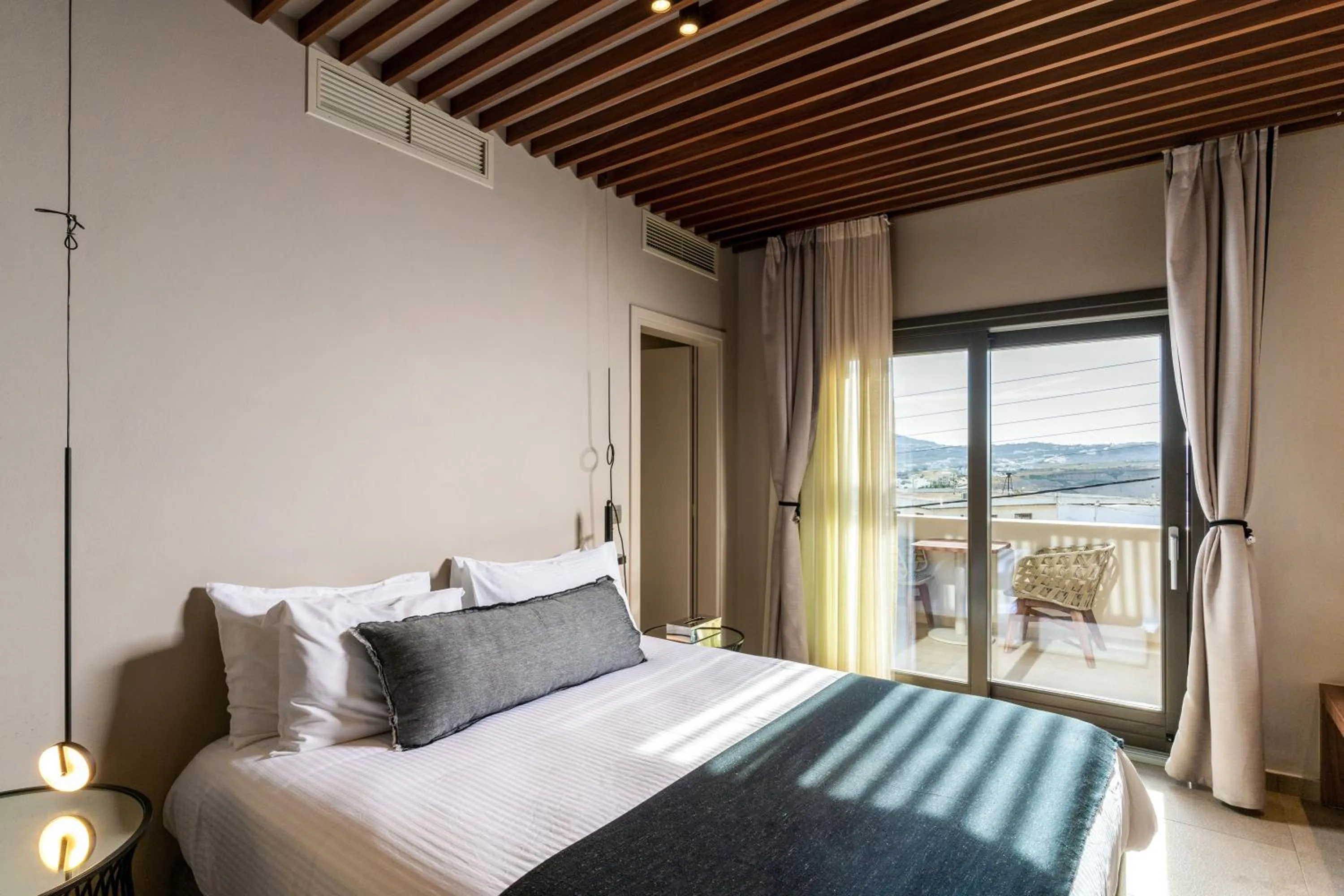 Bed in Uma Ray Suites