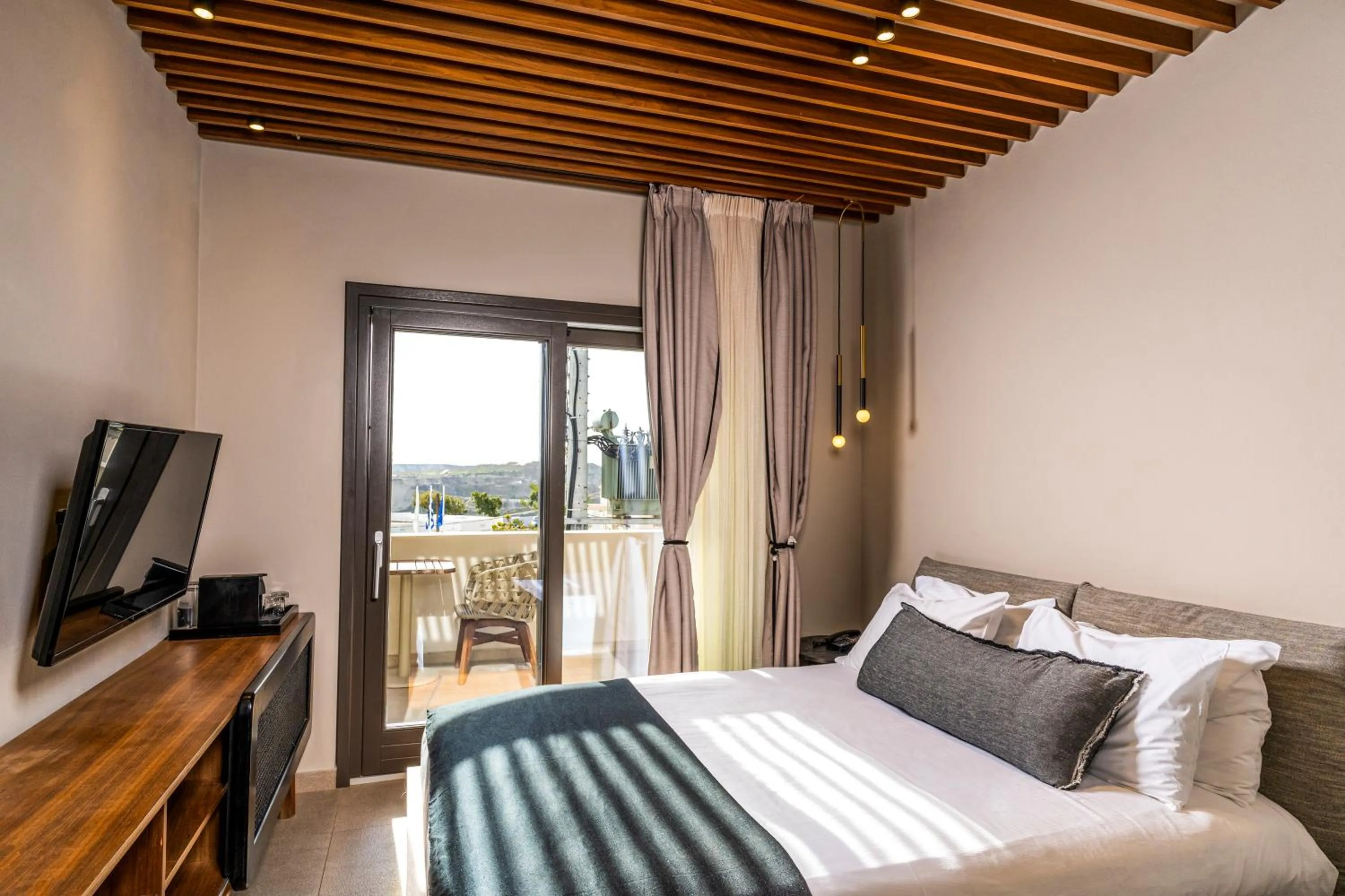 Bed in Uma Ray Suites