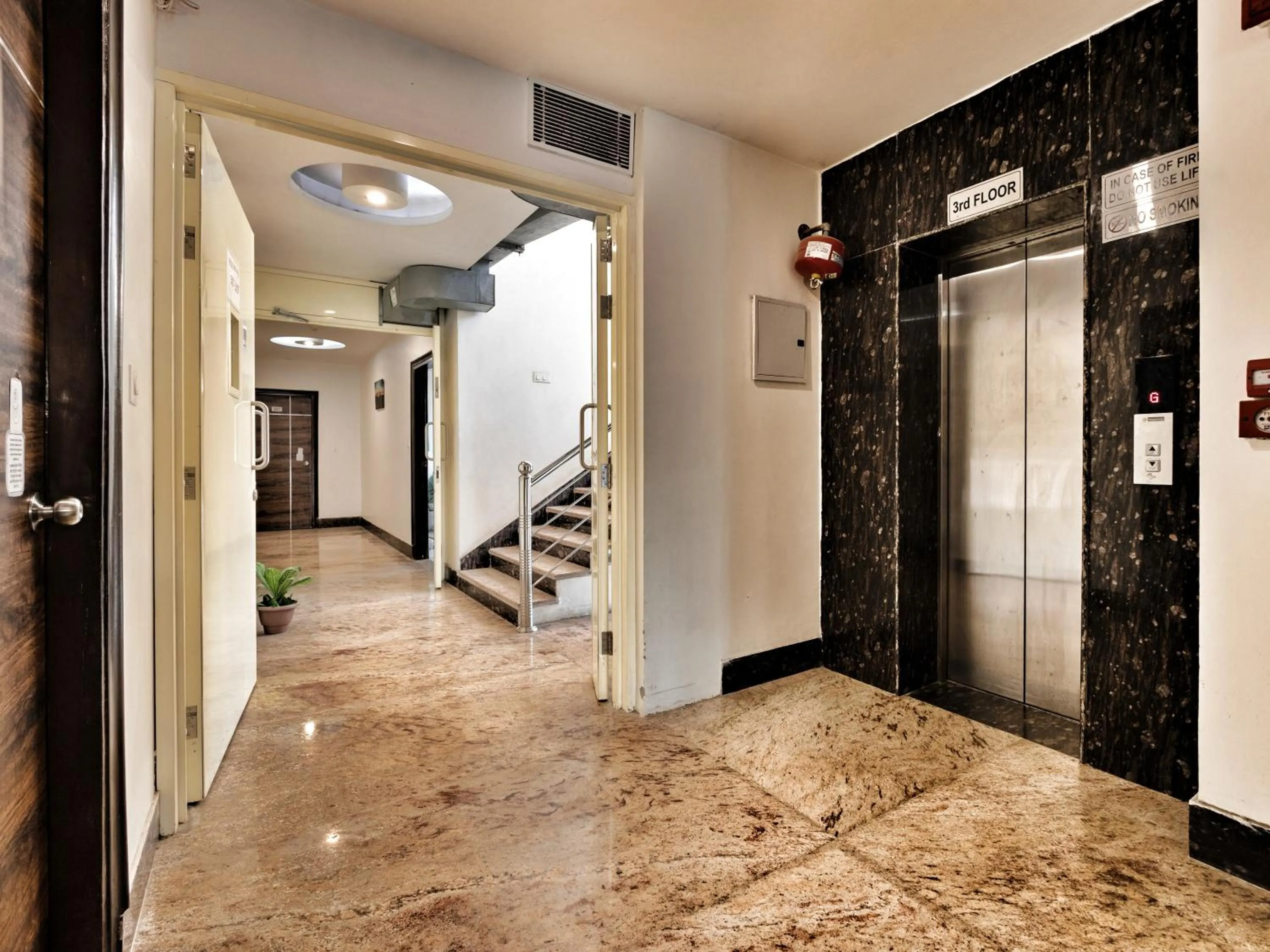 elevator in Hotel Aerocity Purple Orchid