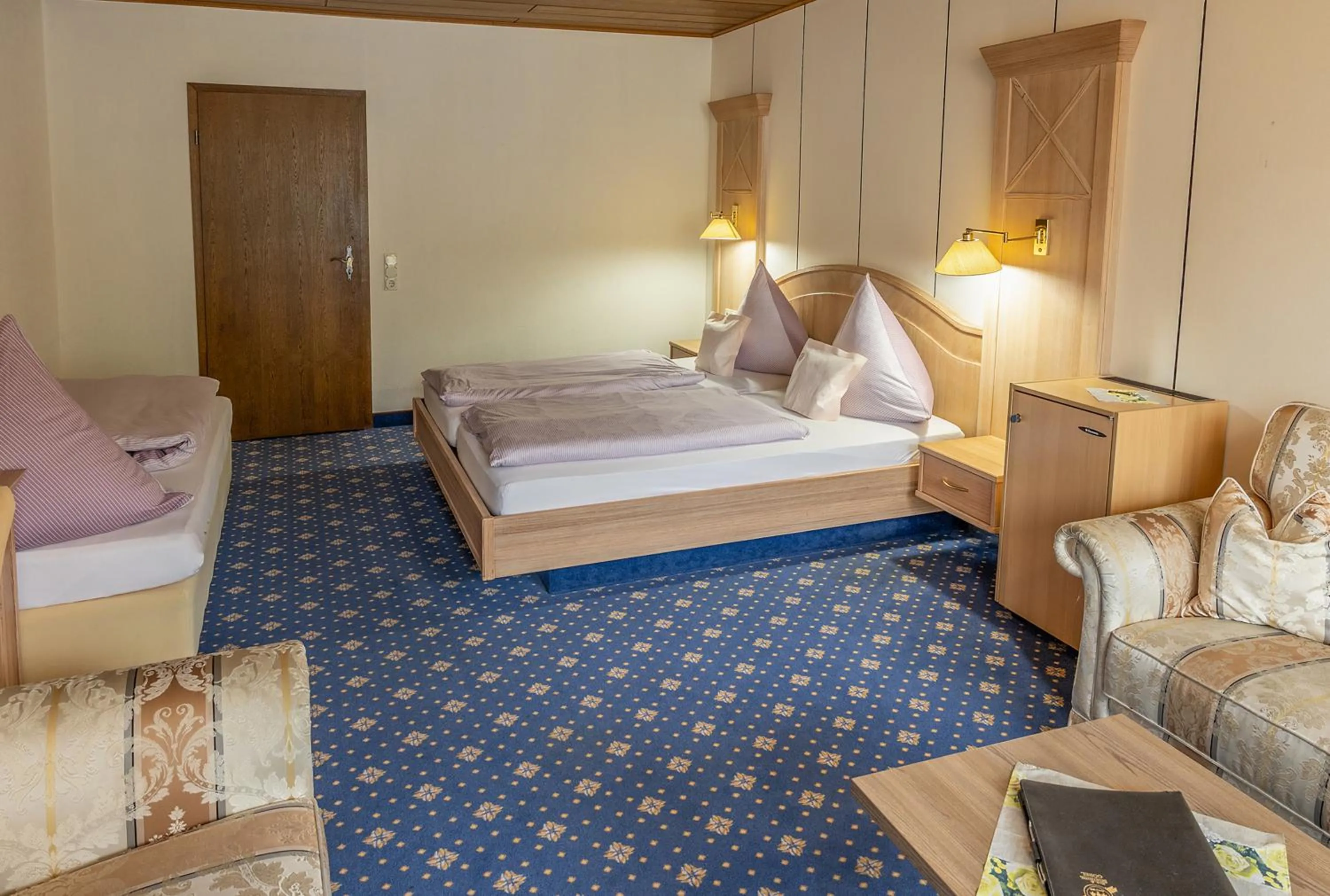 Bed in Sporthotel Göbel Garni