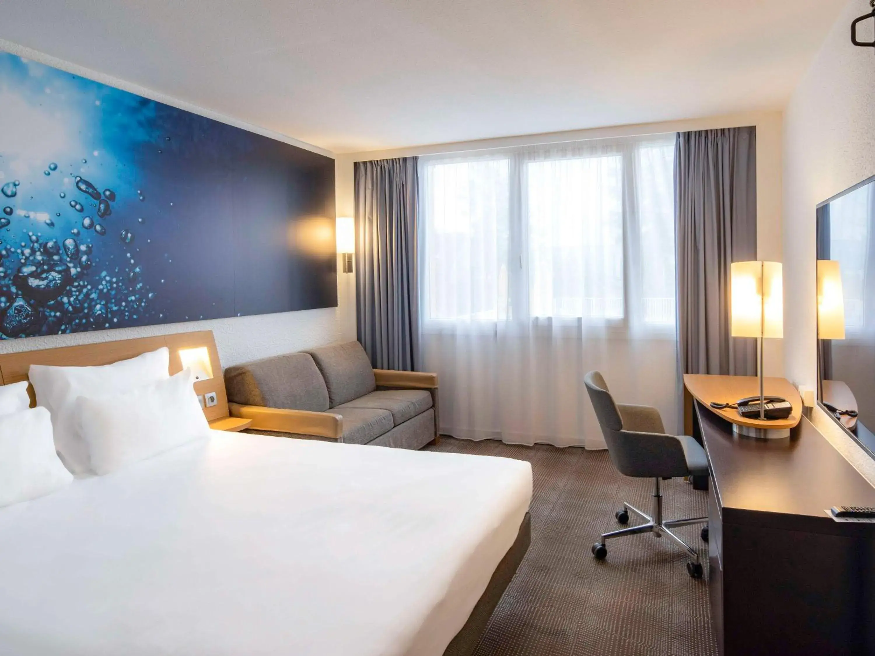 Bed in Novotel Dijon Sud Bed in Novotel Dijon Sud