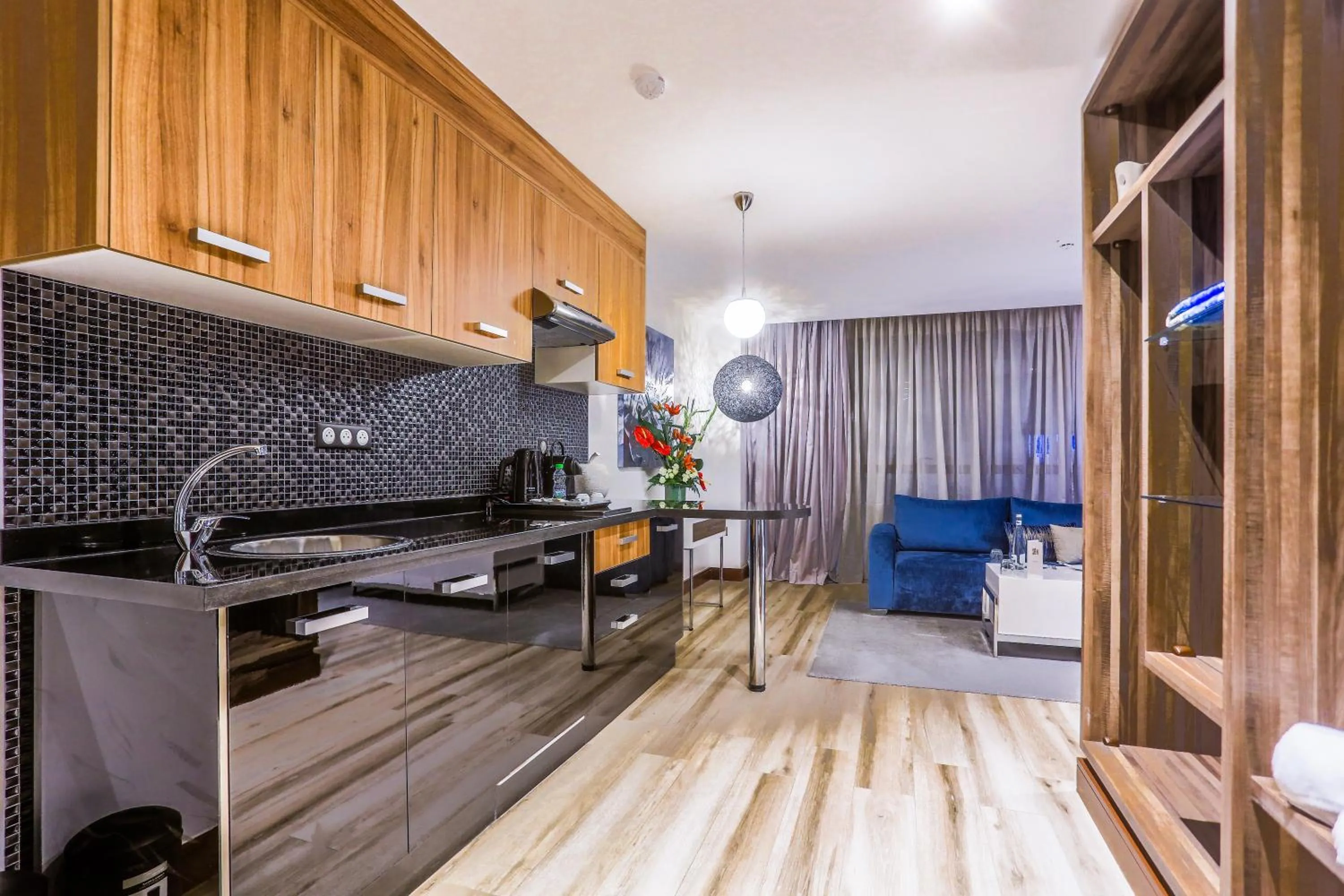 Kitchen or kitchenette in SBN Suite Hôtel